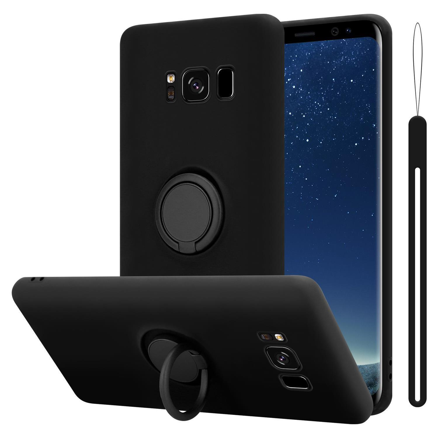 Custodie nere per telefono con supporti ad anello. Una custodia è intorno a un telefono. Altre due sono visibili.