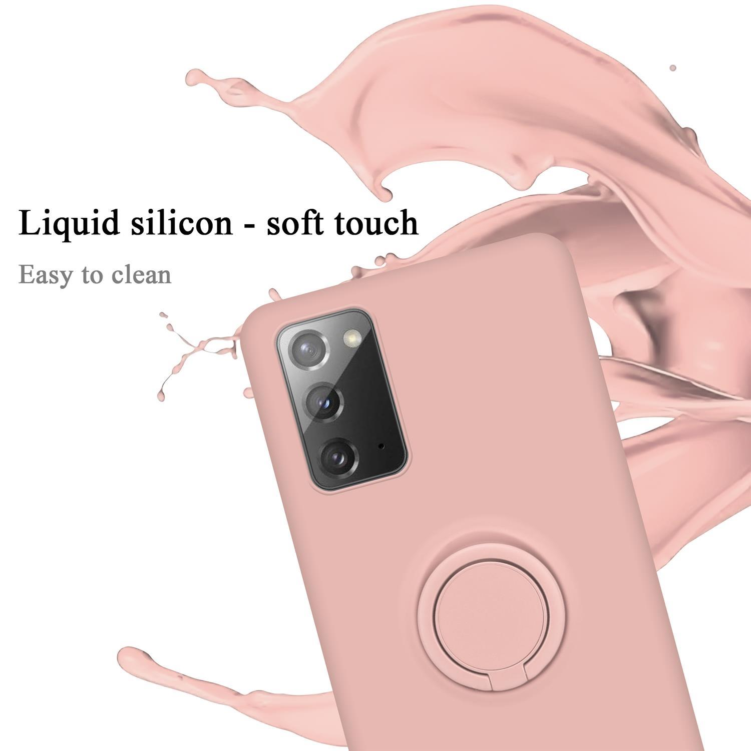 Custodia per telefono rosa con supporto ad anello. Il testo recita 'Liquid silicon - soft touch'. È visibile uno schizzo rosa.