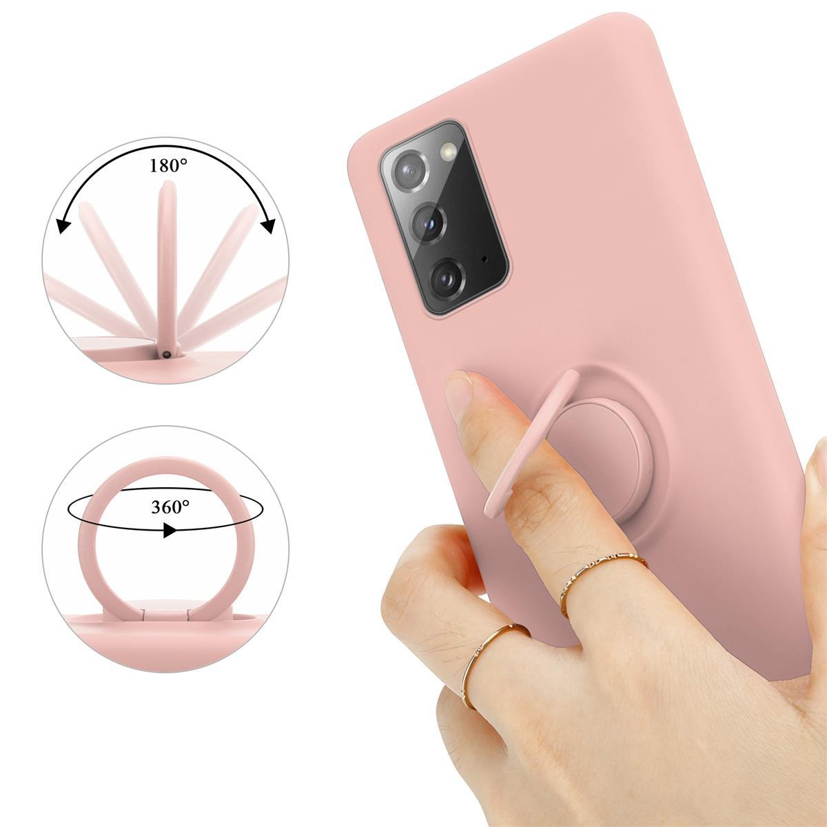 Custodia per telefono rosa con supporto ad anello. Dito che tiene il supporto ad anello. Le frecce mostrano una rotazione di 180 e 360 gradi.