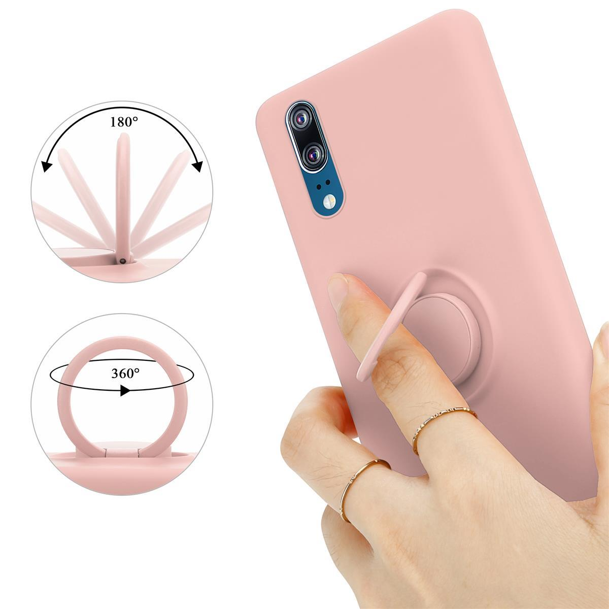 Custodia rosa per telefono con anello, tenuta in mano. L'anello ruota di 360 gradi e può essere un cavalletto.