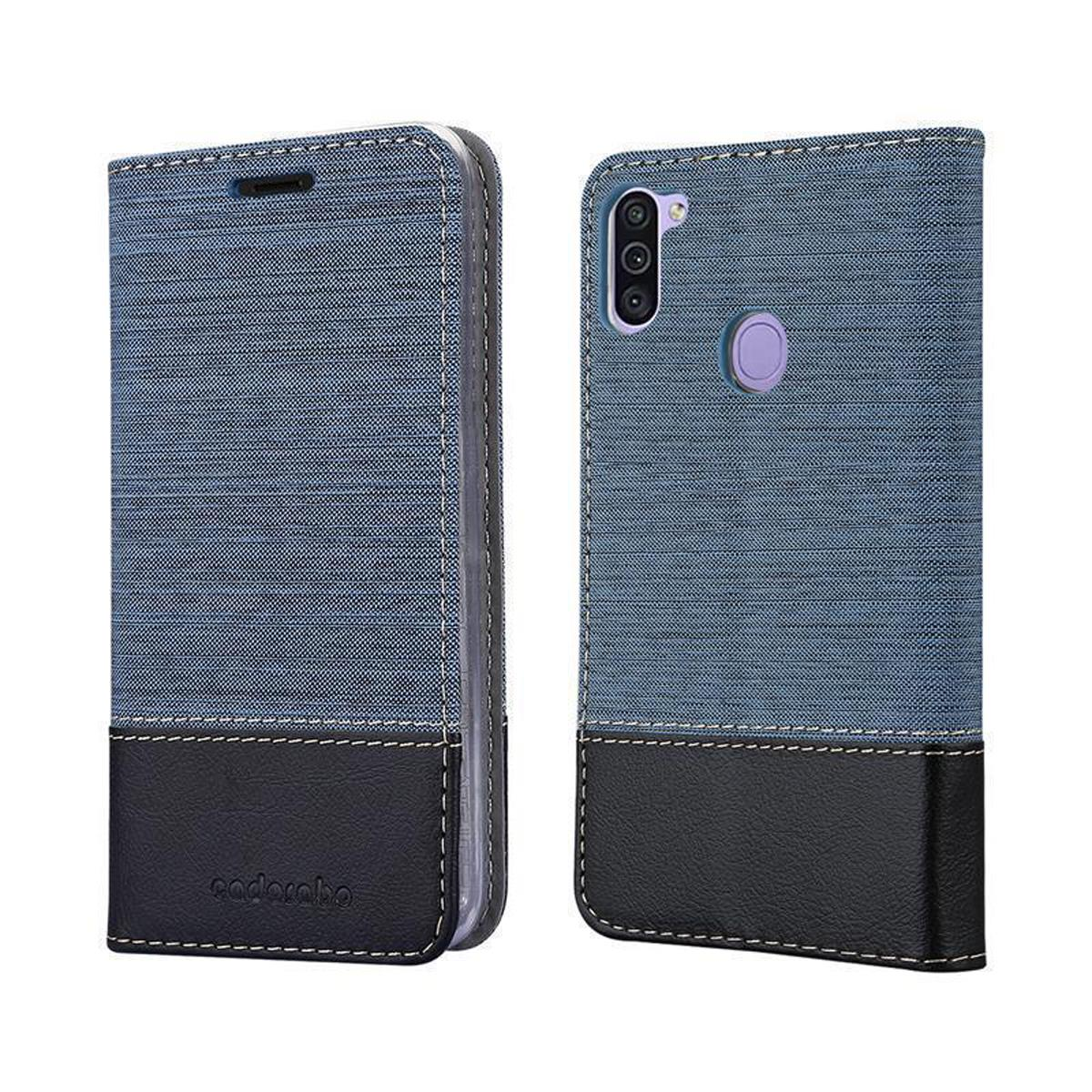 Custodia blu per telefono, aperta, che mostra il telefono all'interno. Combinazione di colori nero e blu. Denim e pelle.