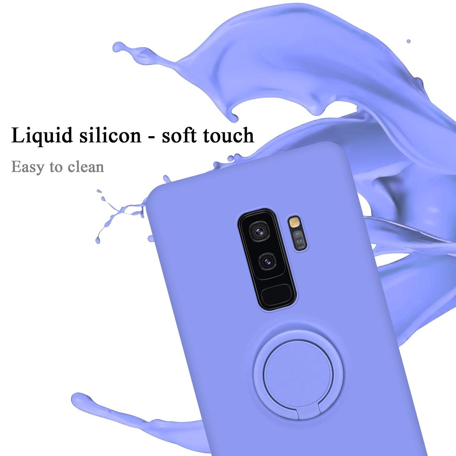Una custodia per telefono viola con un supporto ad anello. La custodia è su una superficie bianca con schizzi di liquido viola.