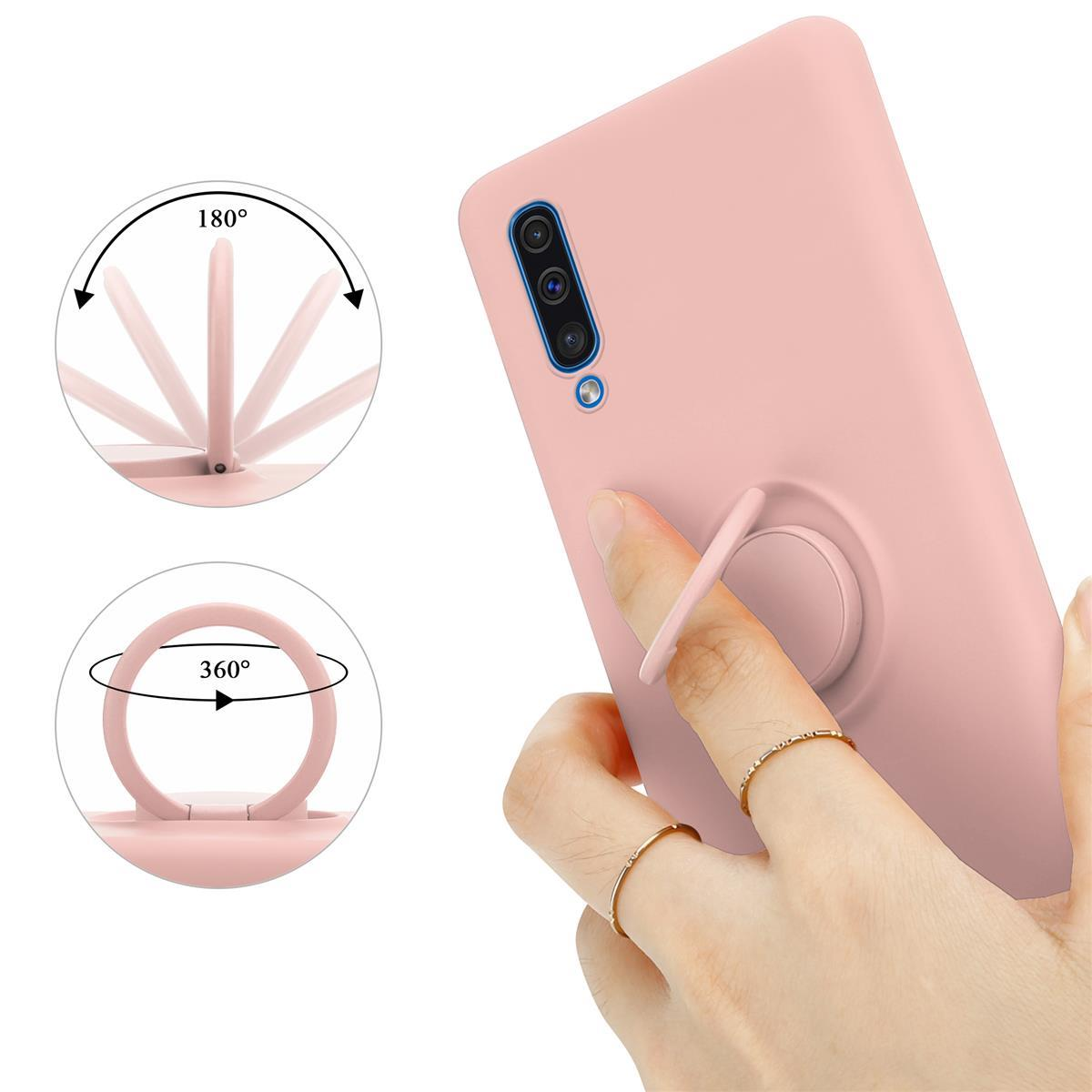 Eine rosa Handyhülle mit Ringhalterung. Der Ring kann sich um 180 und 360 Grad drehen. Eine Hand hält die Hülle.
