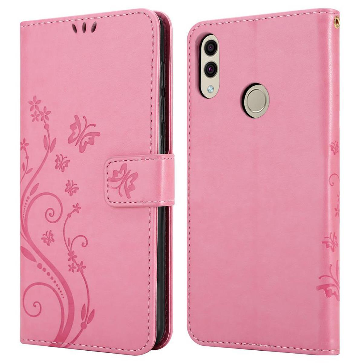 Custodia per telefono rosa con design floreale. La custodia è chiusa e aperta. Il telefono è rosa.