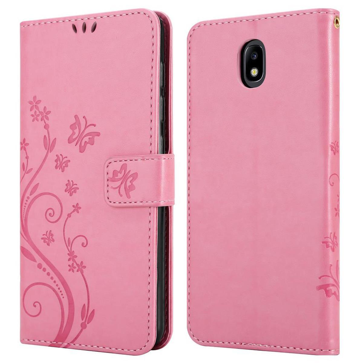 Custodia per telefono rosa con un design a farfalla. Ha una chiusura e un telefono all'interno. Il retro ha una fotocamera.