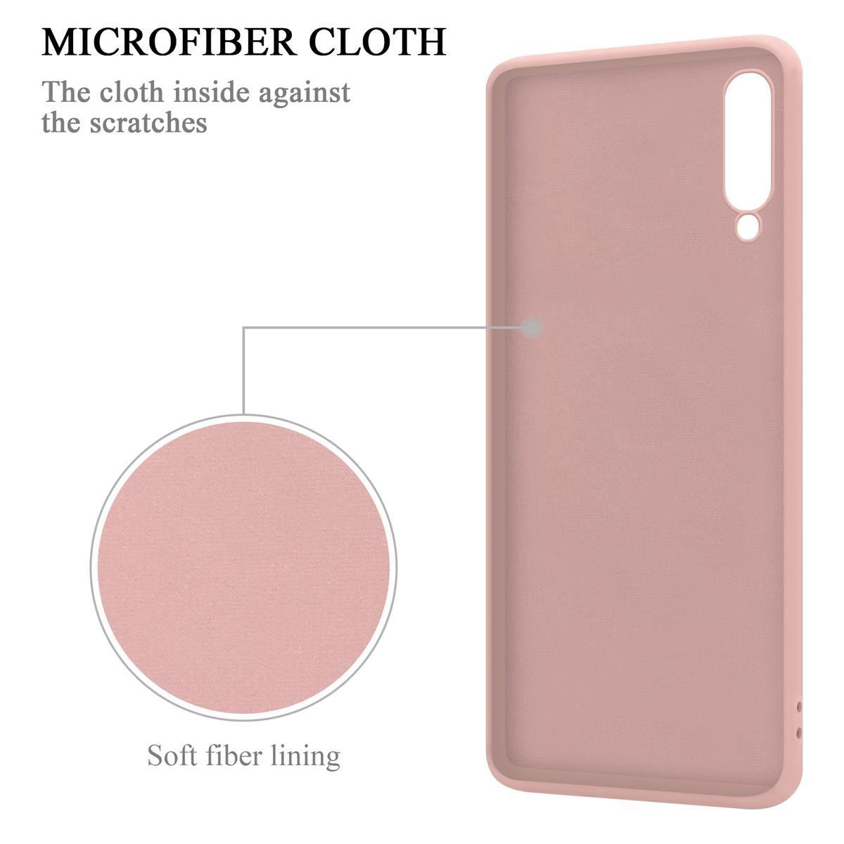 Custodia per telefono rosa, vista interna. Il testo dice 'Fodera in fibra morbida'. Cerchio con una freccia che punta verso l'interno.