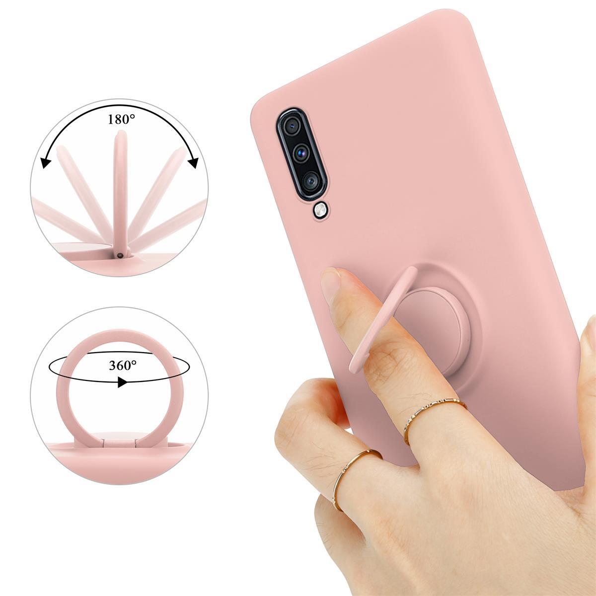 Custodia rosa per telefono con anello di supporto. Mano che tiene la custodia. Anello di supporto a 180 e 360 gradi.