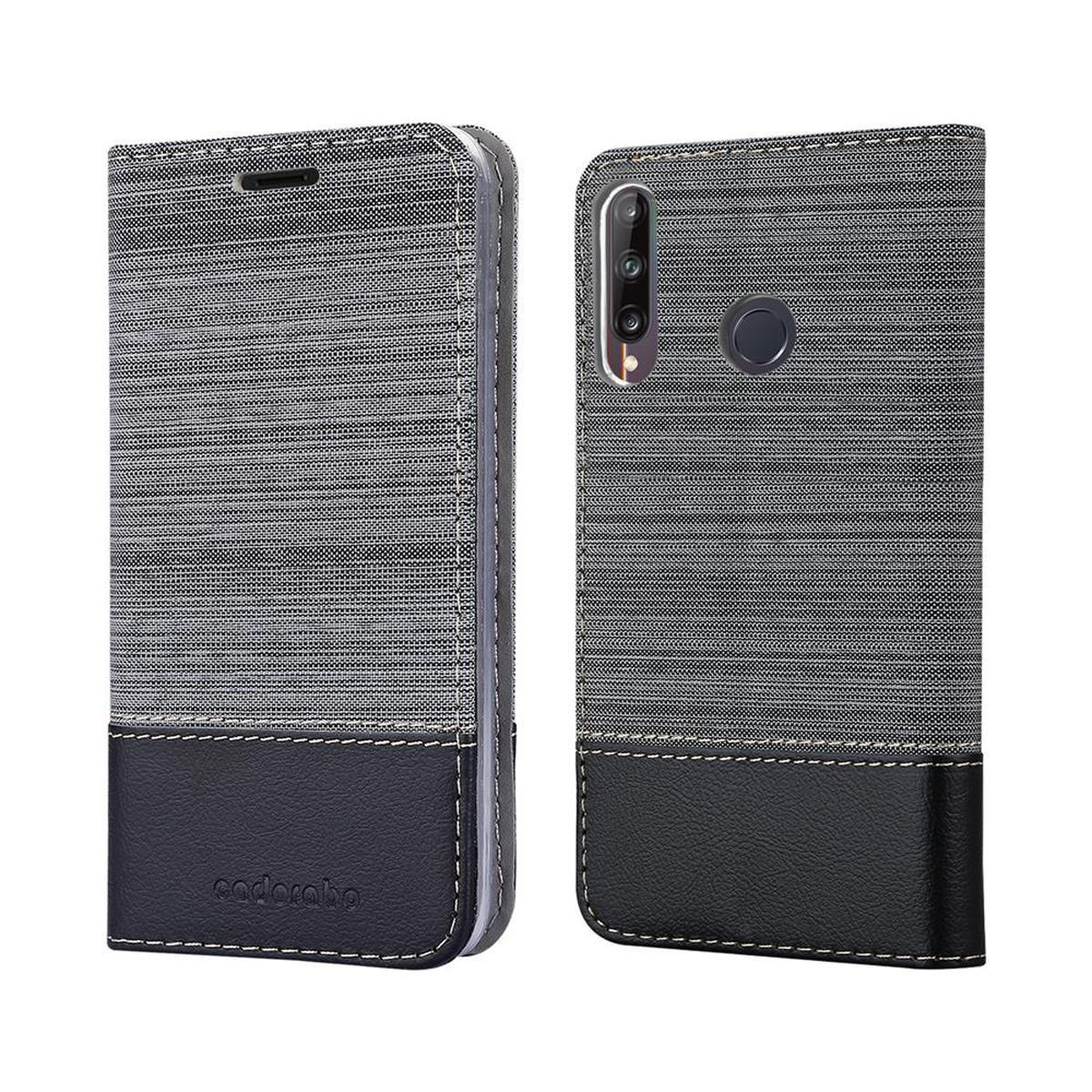Custodia per telefono, aperta, con un design in tessuto grigio e nero. Il logo Cadaraba è in basso.