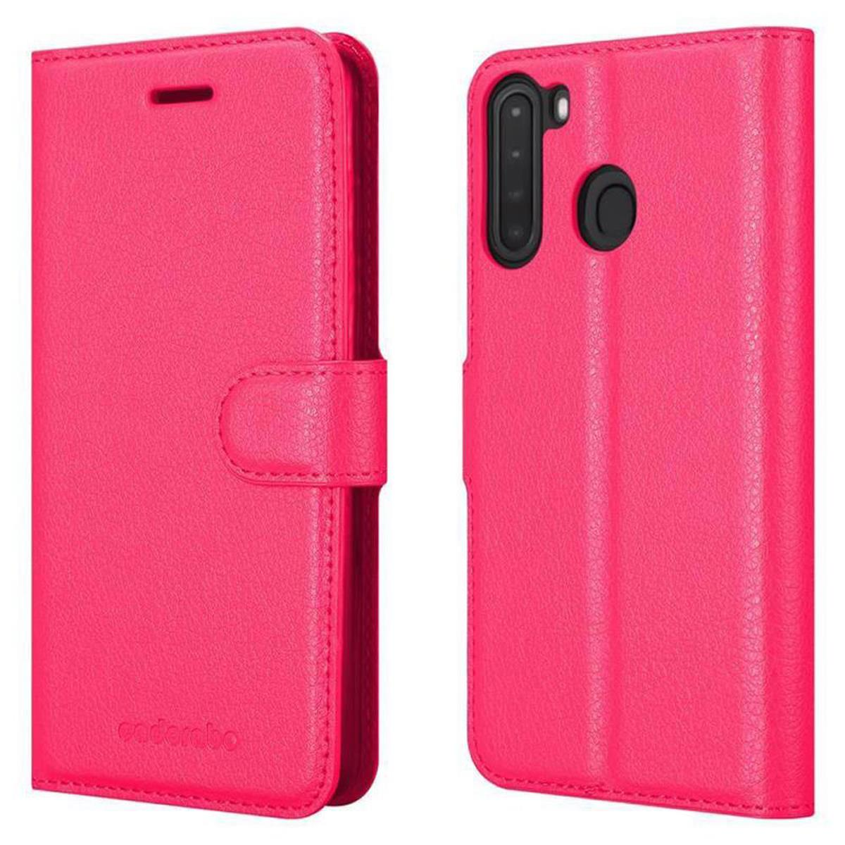 Una custodia per telefono rosa, chiusa e aperta. La custodia chiusa ha una chiusura.