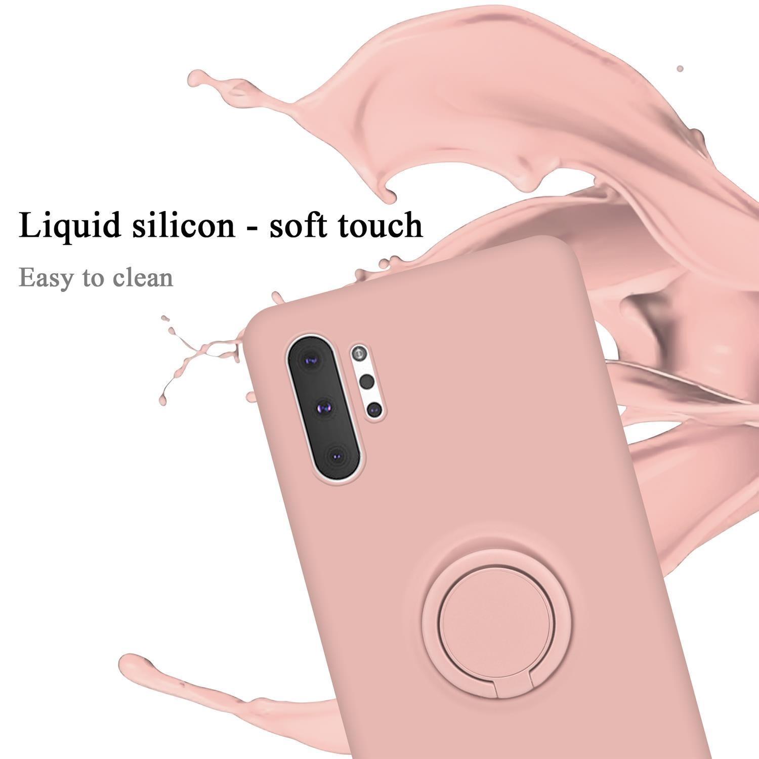 Una custodia per telefono rosa con un supporto ad anello, con testo sul suo tocco morbido.