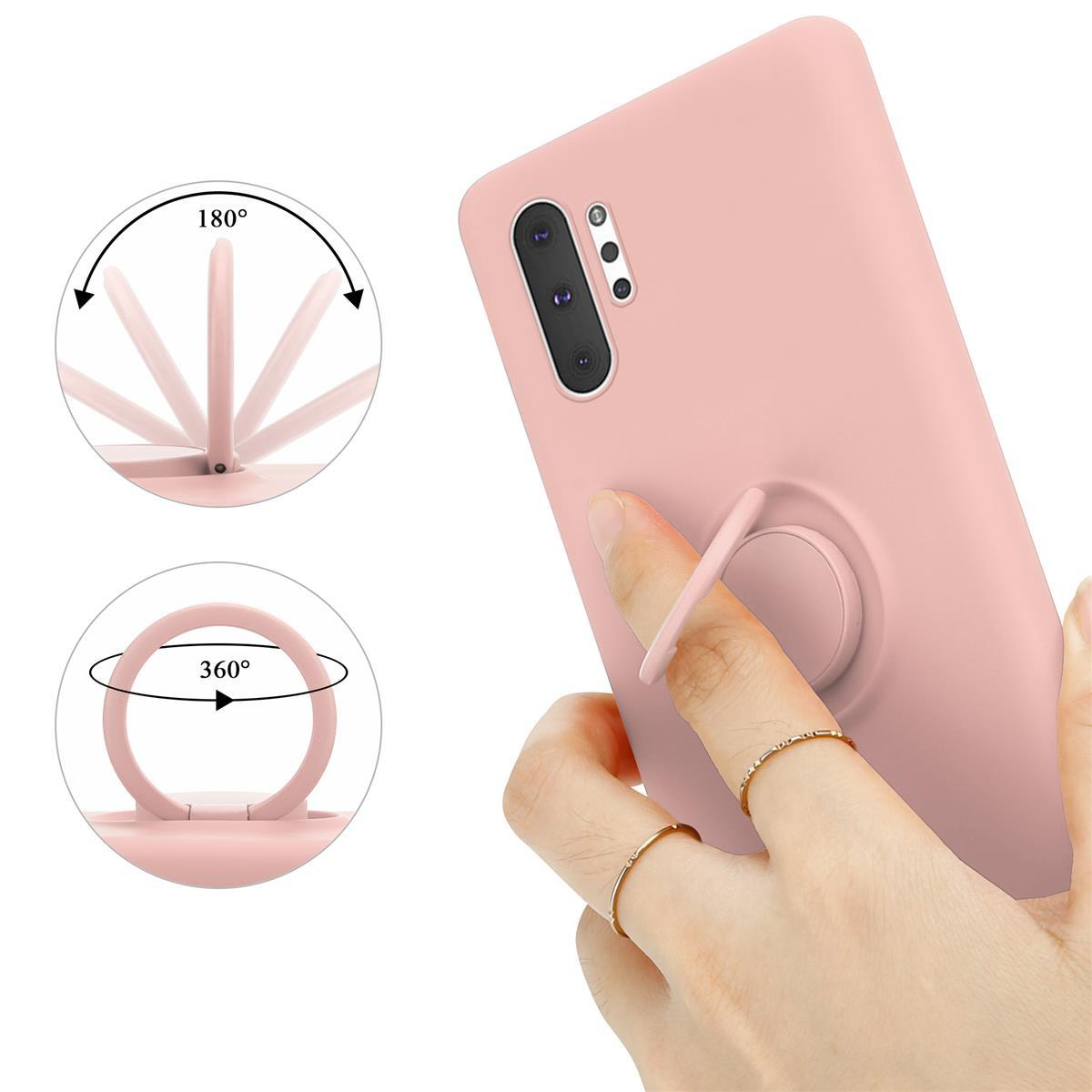 Una custodia rosa per telefono con un supporto ad anello sul retro, con una mano che lo usa e frecce di rotazione.