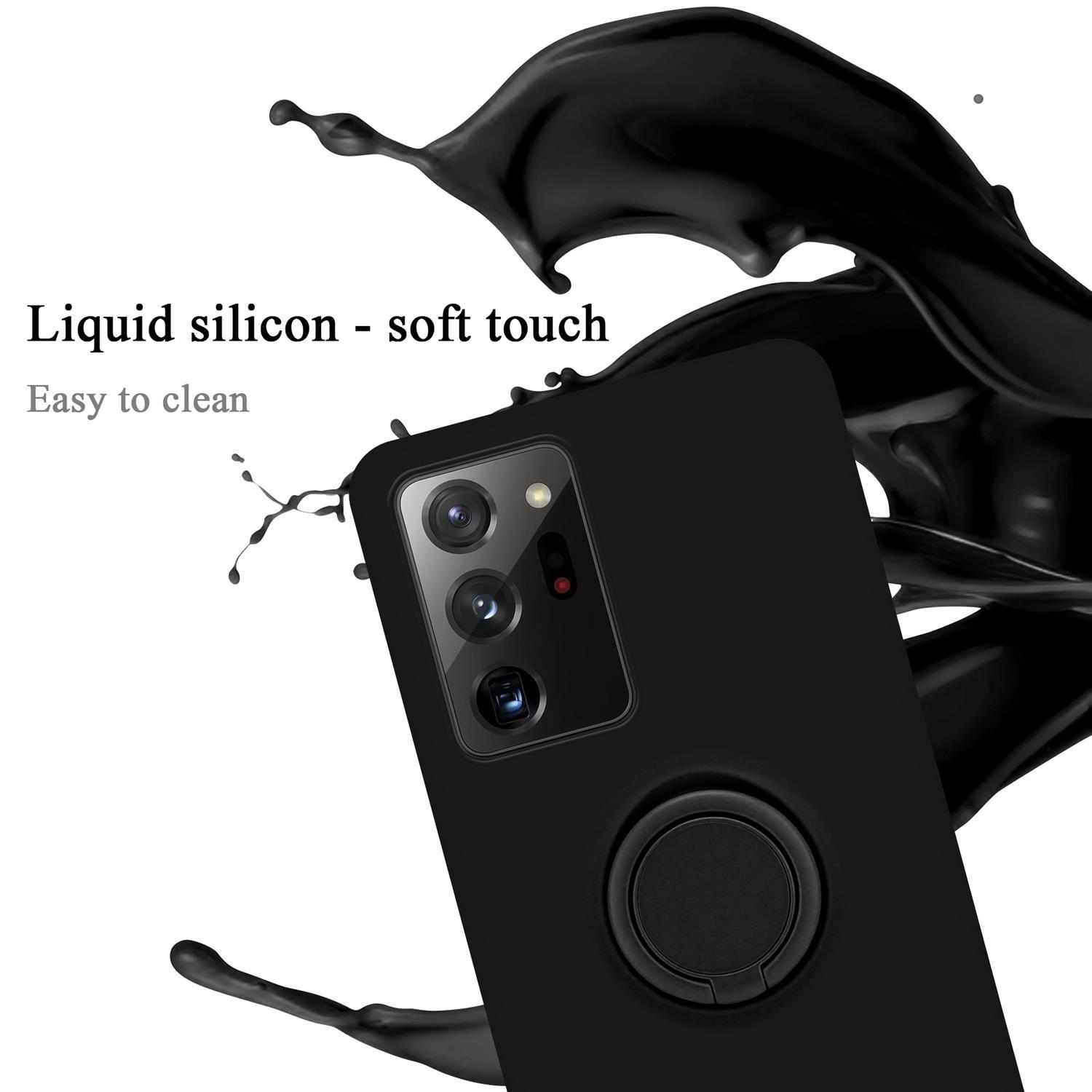 Custodia per telefono nera con supporto ad anello. Schizzo di liquido nero attorno al telefono. Testo: Silicone liquido - tocco morbido. Facile da pulire.