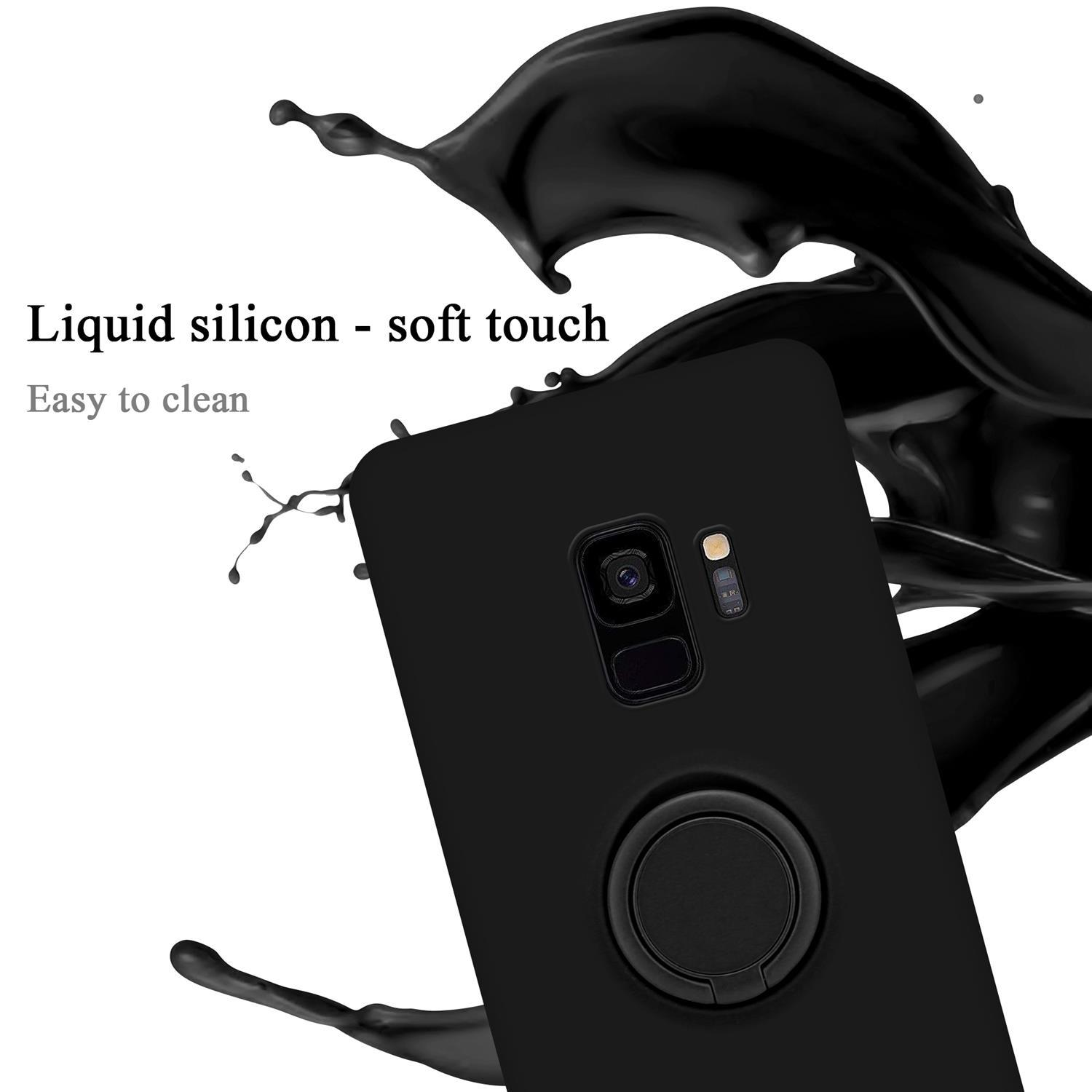 Custodia per telefono nera con anello di supporto, con spruzzi di liquido nero sullo sfondo.
