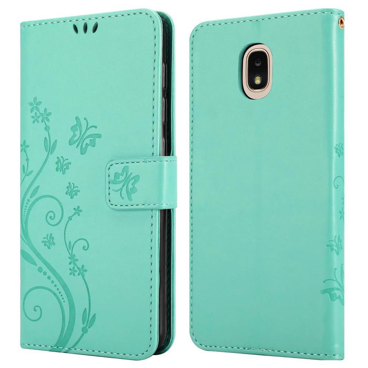 Una custodia per telefono verde menta con design floreale e farfalle, aperta e chiusa. Il telefono è visibile quando è aperta.