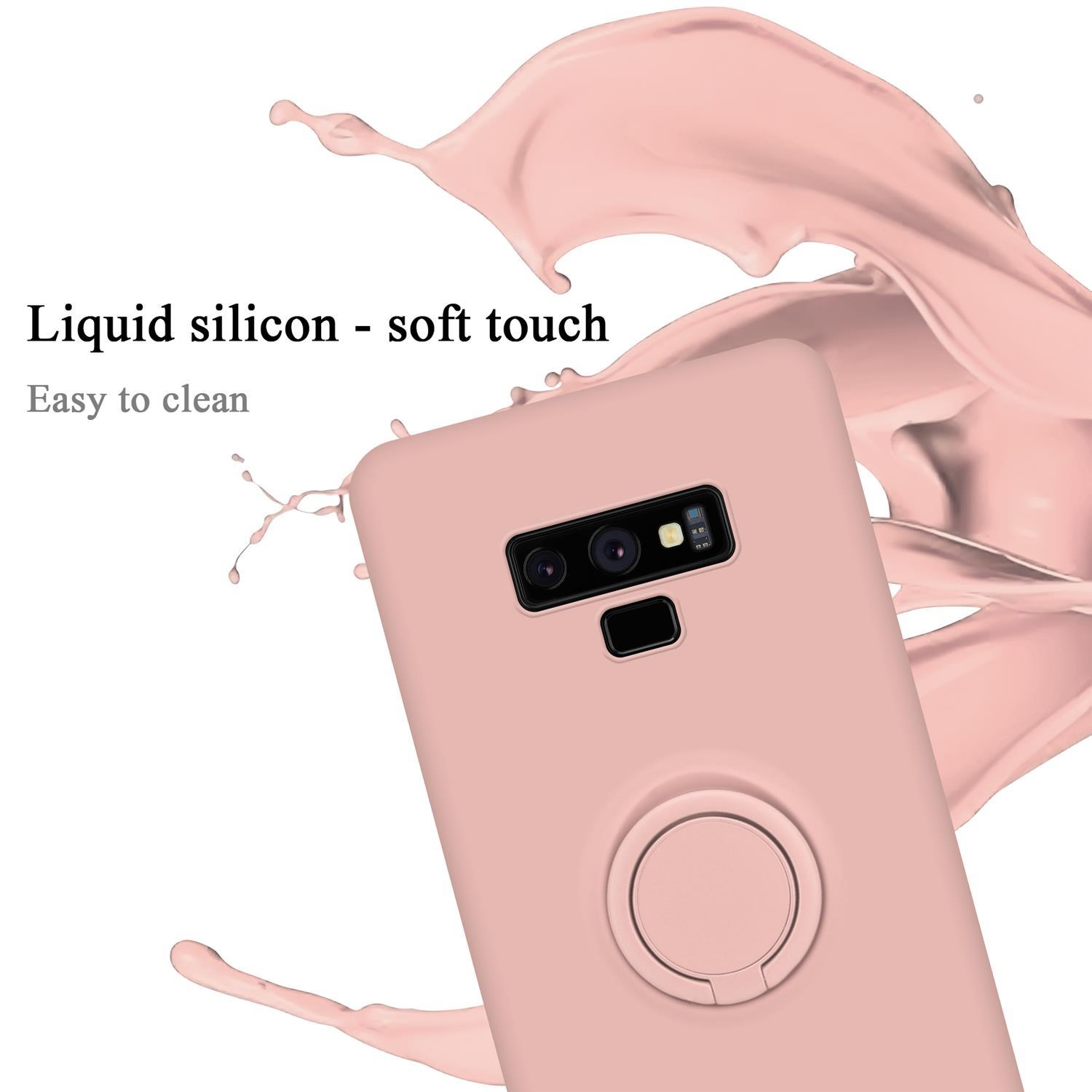 Una custodia rosa per telefono con supporto ad anello sul retro, con testo in silicone liquido, facile da pulire.