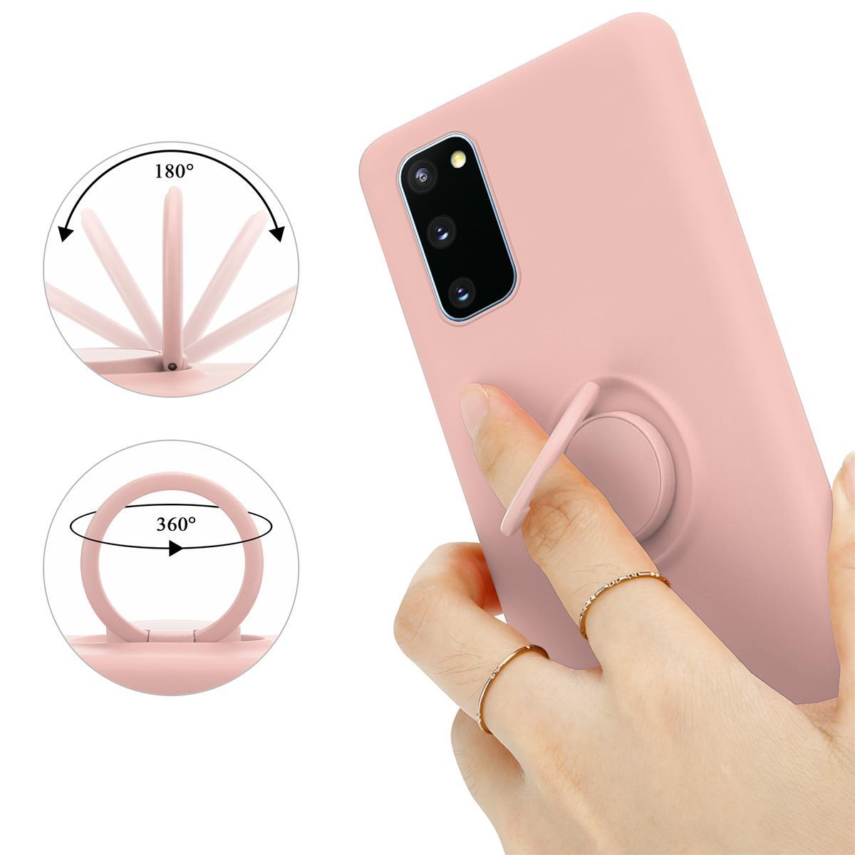 Ein rosa Telefon mit einem Ringhalter, der sich dreht. Ein Finger mit Ringen hält es.