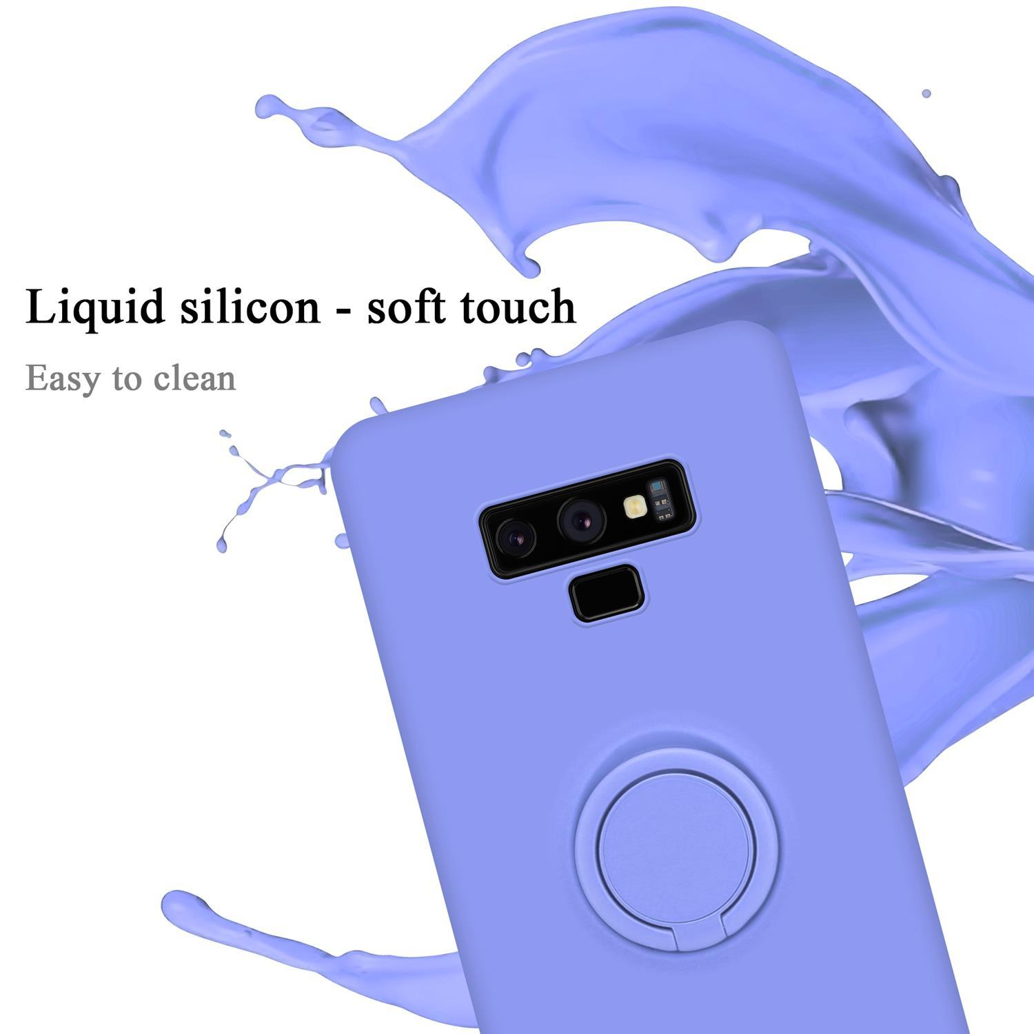Una custodia per telefono viola con supporto ad anello. Testo: Silicone liquido - tocco morbido. Facile da pulire.