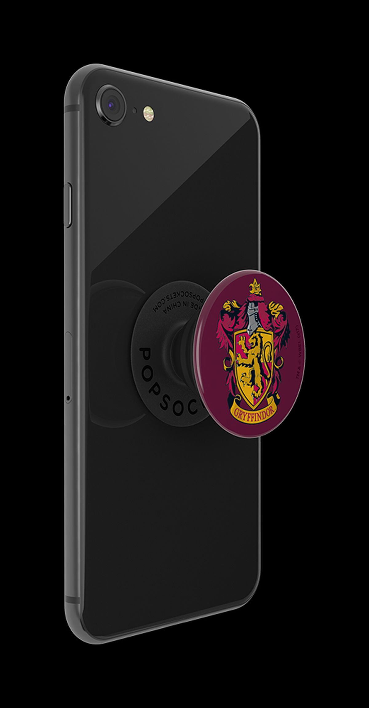 Teléfono negro con un PopSocket de Gryffindor. Fondo negro.
