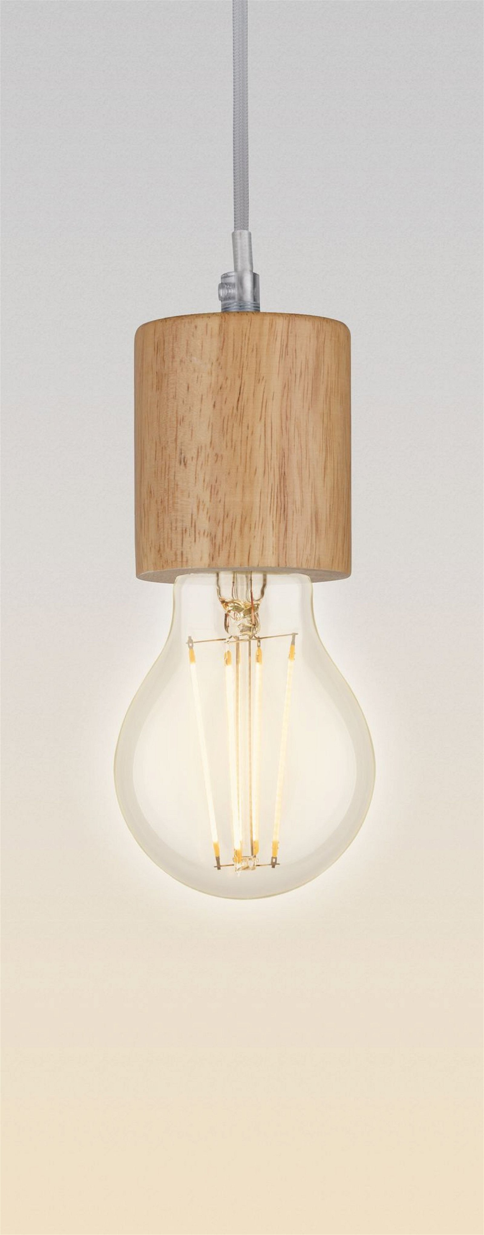 Una lampadina appesa a un'apparecchiatura in legno.