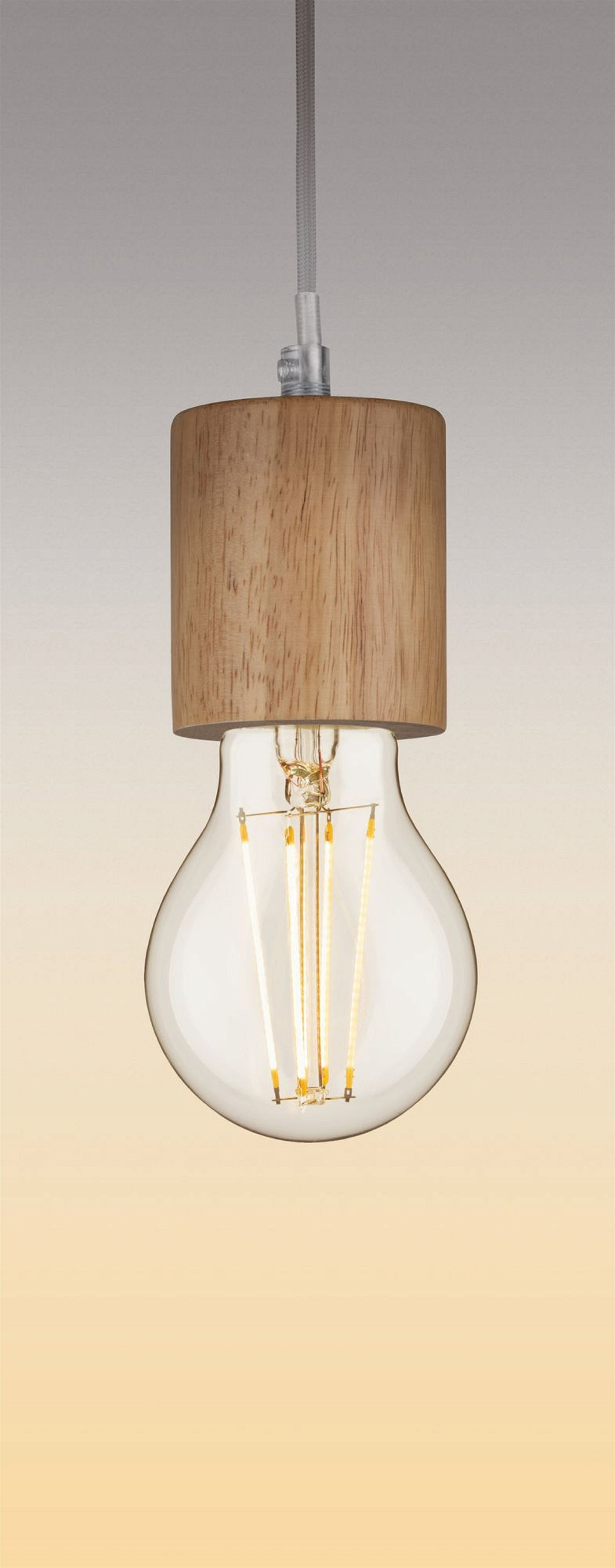 Una lampadina a incandescenza con la parte superiore in legno, che mostra il filamento.