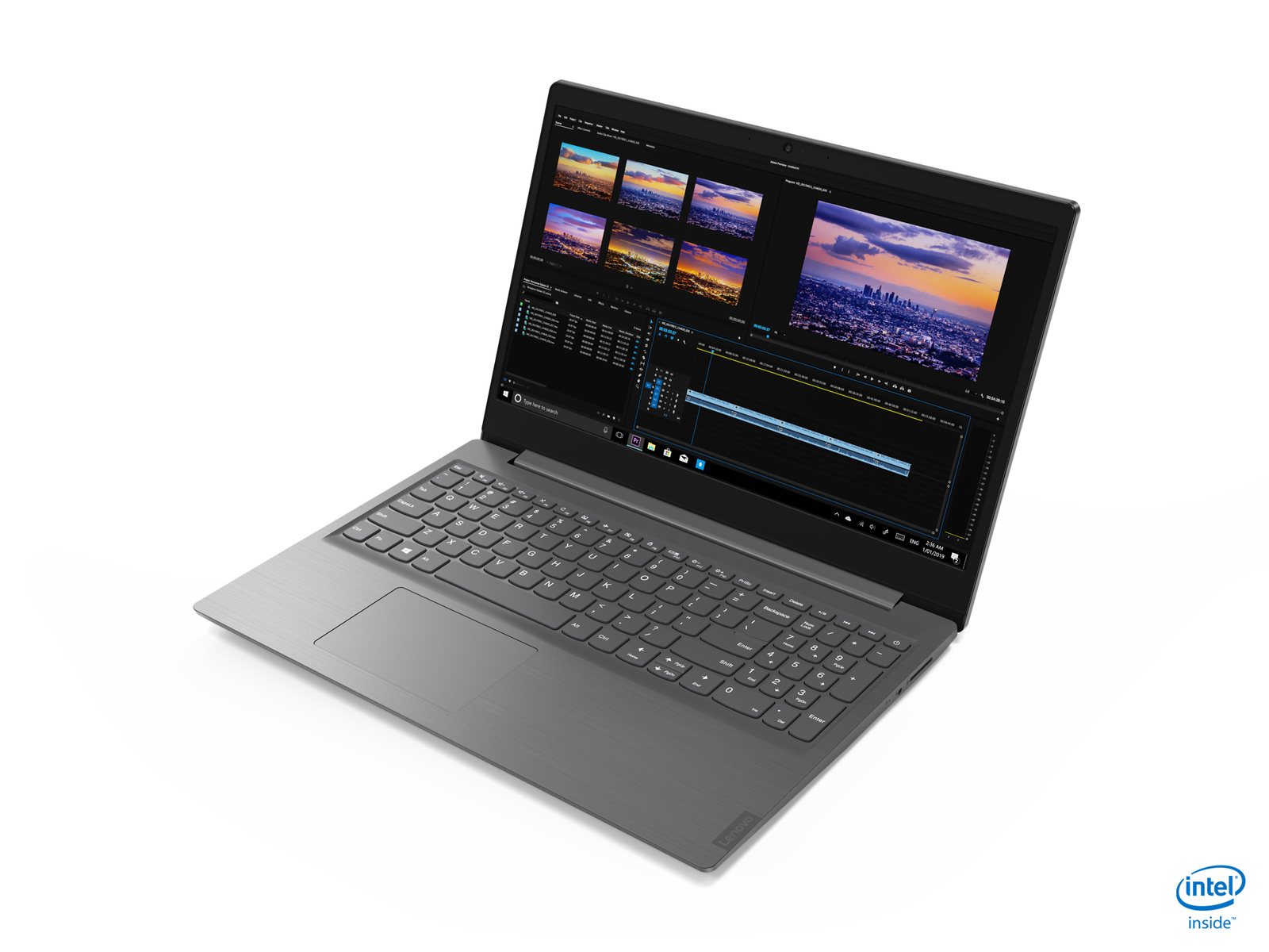 Laptop su superficie bianca con software di editing video che mostra vari clip video.