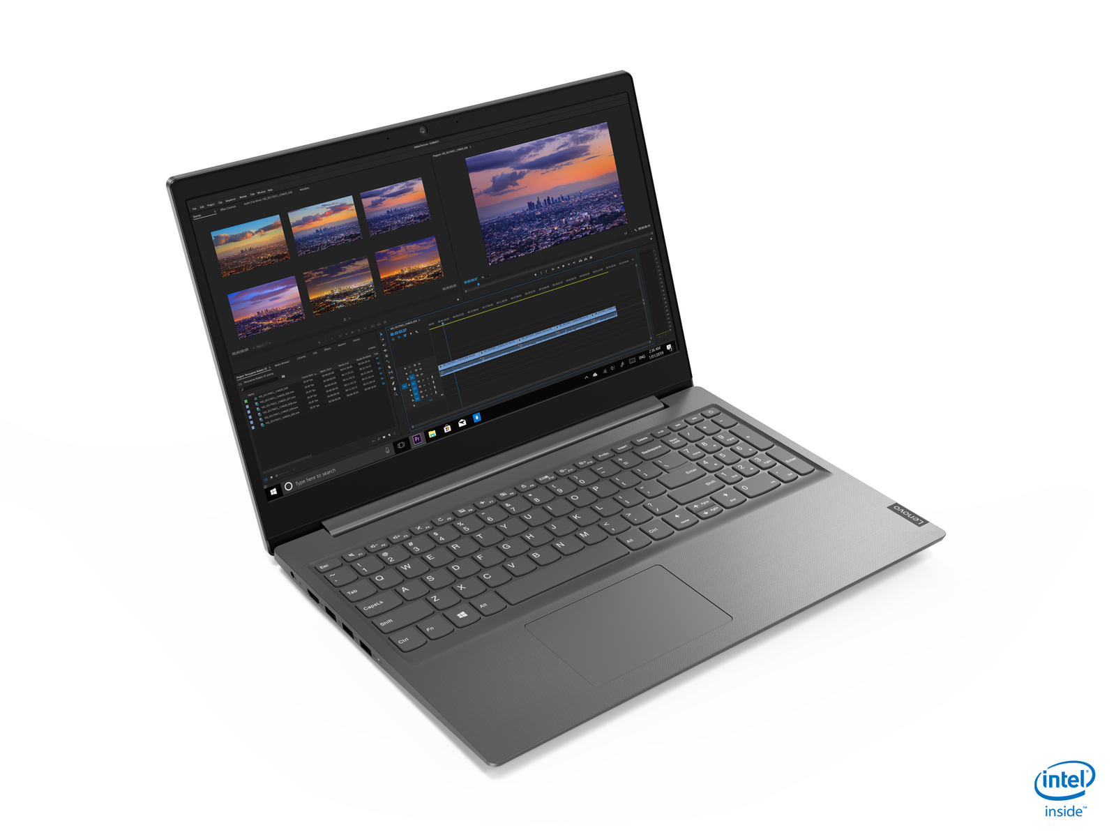 Laptop su superficie bianca con software di editing video che mostra vari clip video.