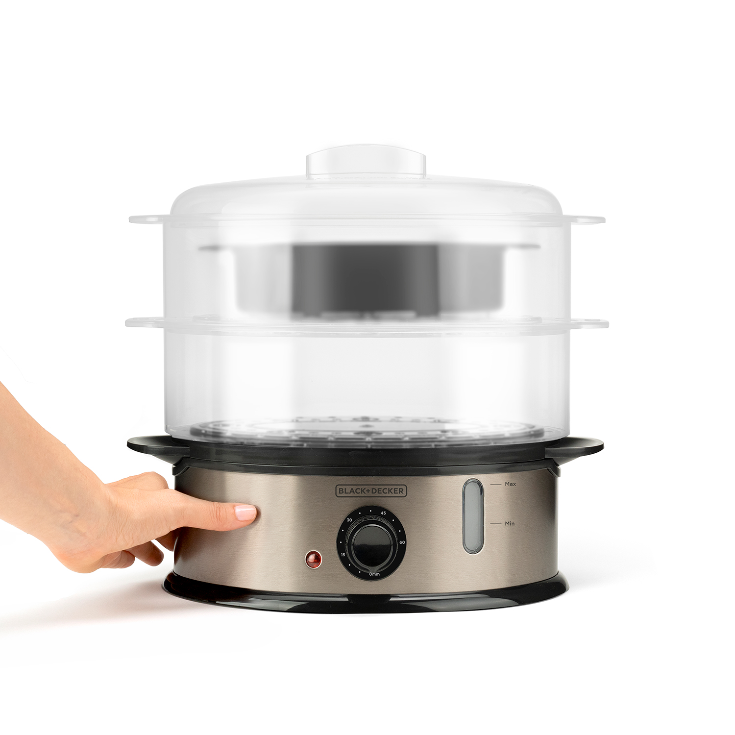 Una mano preme il pulsante di un vaporizzatore per alimenti argento e nero con strati trasparenti.