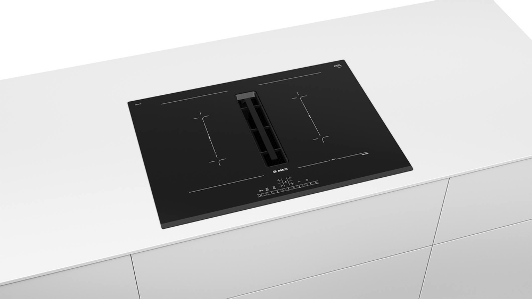 Placa de inducción negra sobre encimera blanca. Tiene dos zonas de cocción y ventilación central.