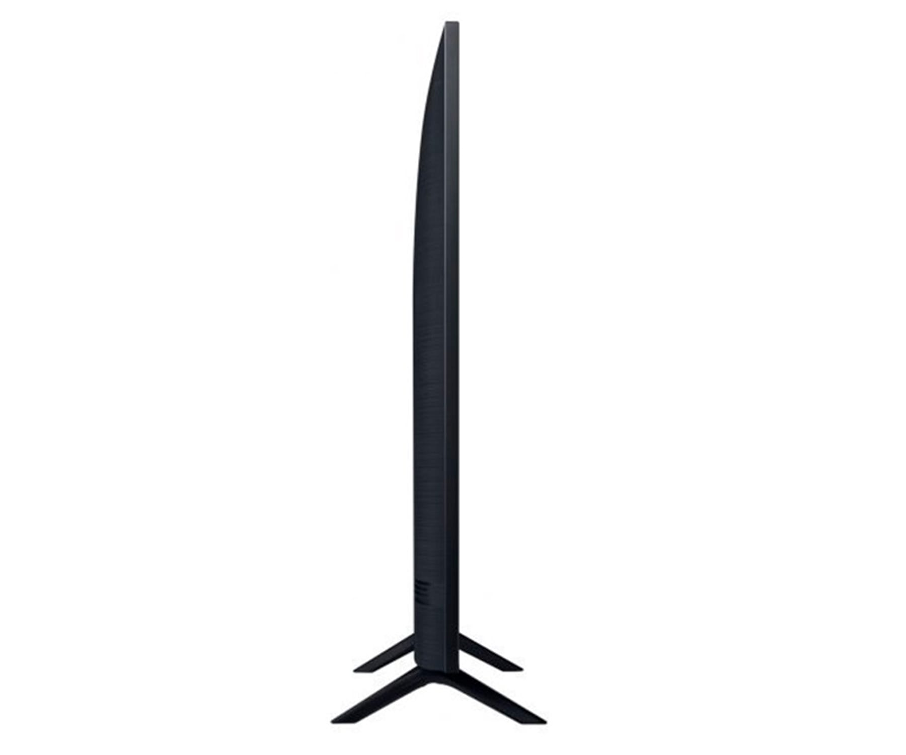 Vista laterale di una TV nera su supporto. È un design sottile.
