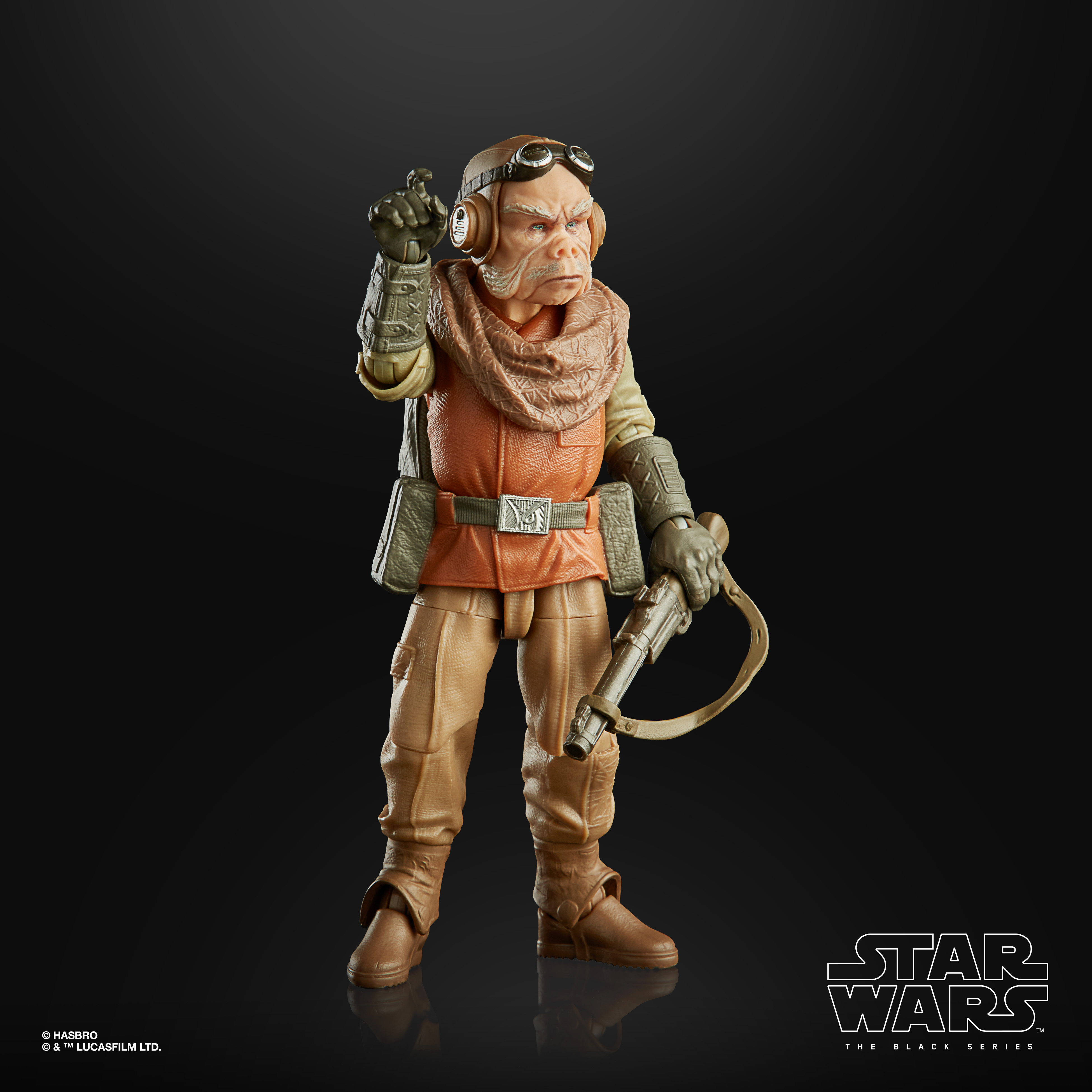 Eine Star Wars-Figur eines außerirdischen Charakters in einem braun-orangenen Outfit, der eine Waffe hält.