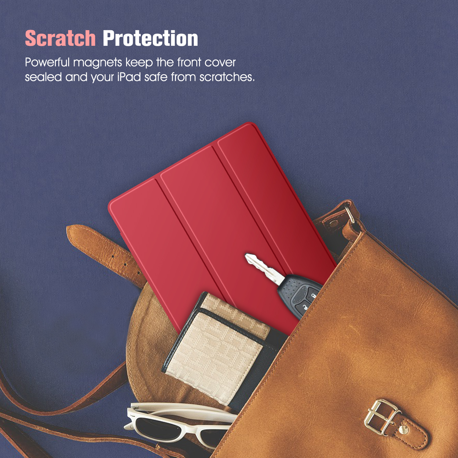 Ein rotes Tablet liegt in einer braunen Tasche mit Geldbörse, Brille und Schlüsseln.