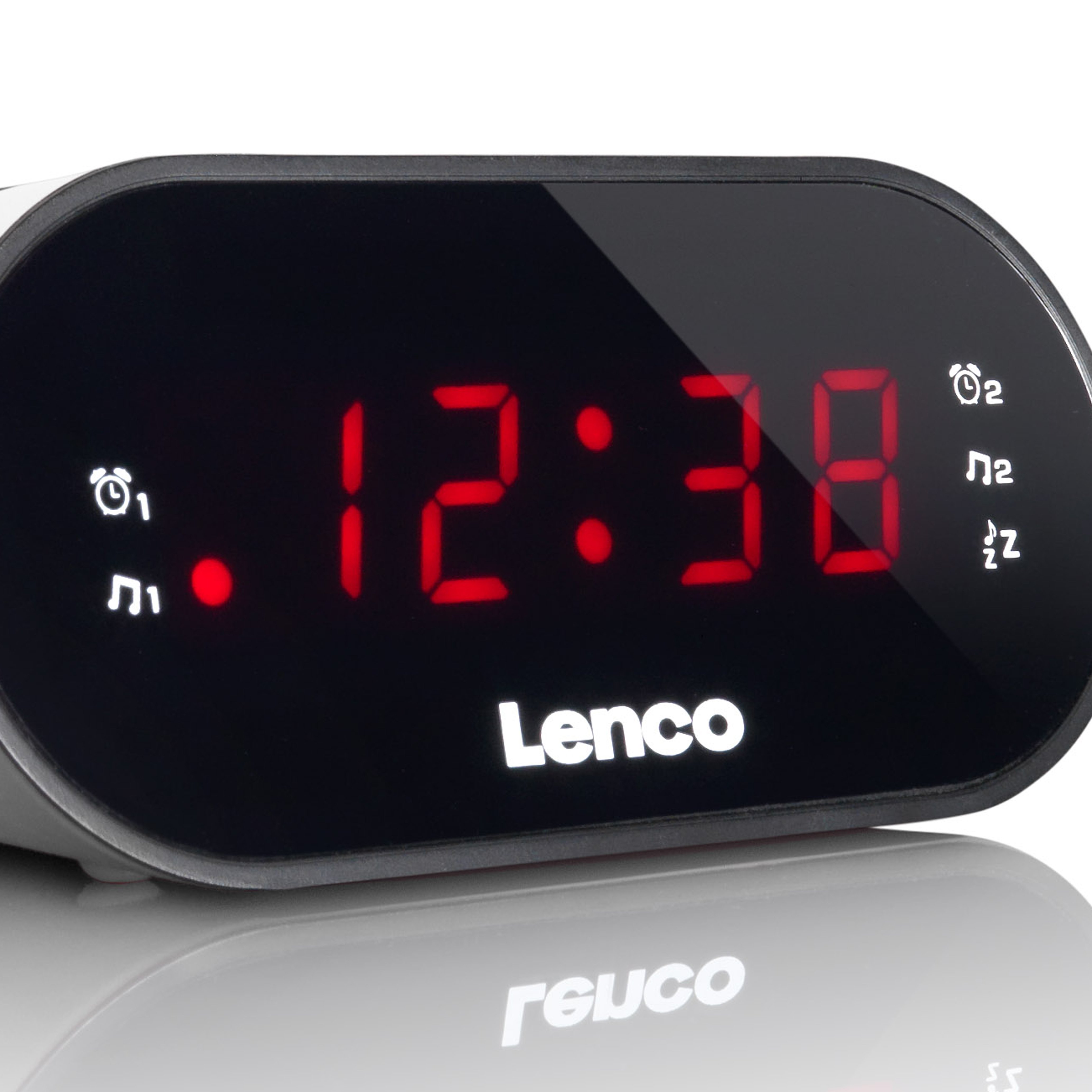 Czarny budzik cyfrowy z czerwonymi cyframi wyświetlającymi godzinę 12:38.