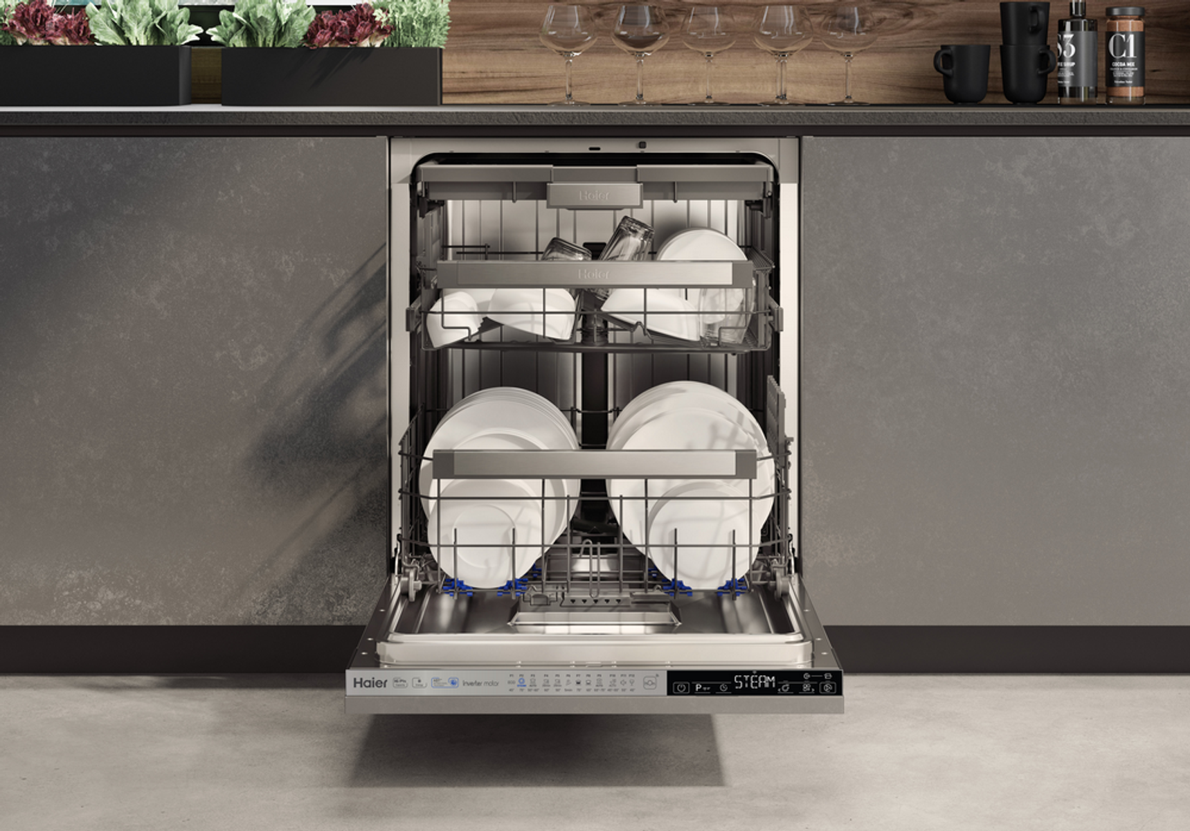 Un lavavajillas con la puerta abierta y platos dentro. El lavavajillas es de acero inoxidable.
