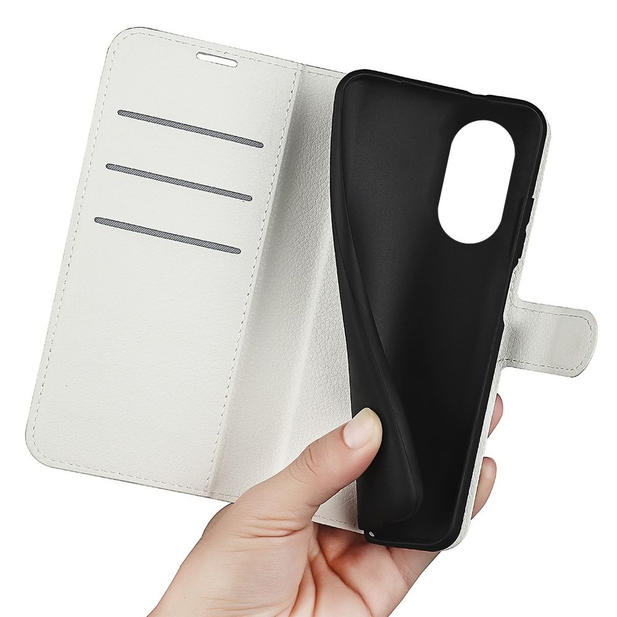 Hand hält eine weiße Handyhülle und zeigt einen schwarzen Telefonhalter.