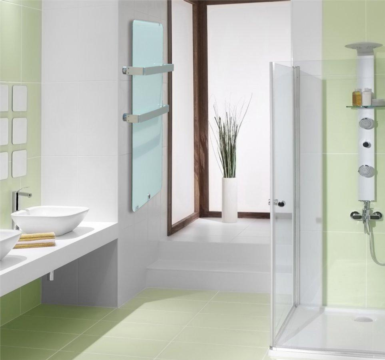 Nowoczesna łazienka z zielonymi kafelkami, białą umywalką, prysznicem i szklanym grzejnikiem.