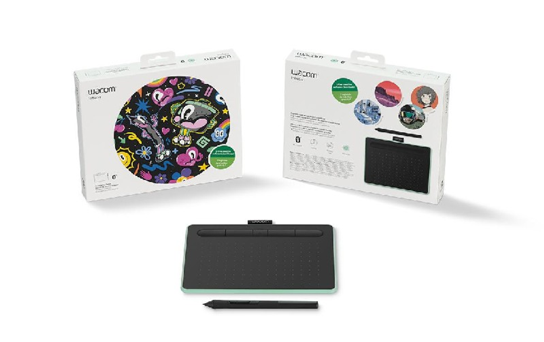 Tablet Wacom Intuos Pro, pióro i pudełka są wyświetlane na białej powierzchni.