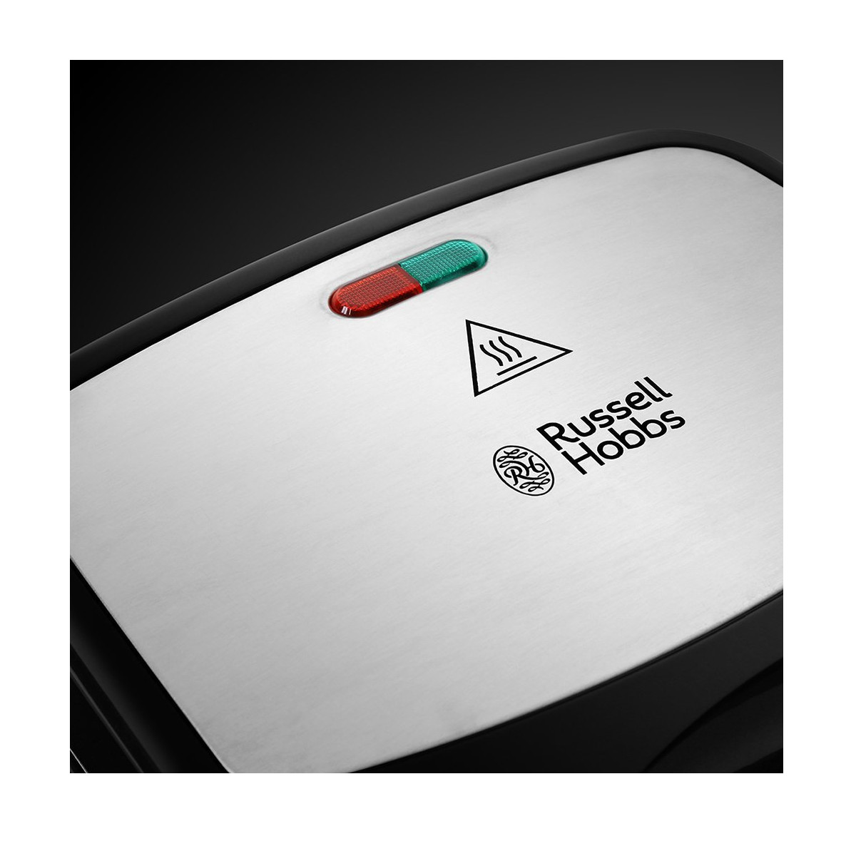 Widok z góry na urządzenie Russell Hobbs z czerwoną i zieloną kontrolką oraz symbolem ostrzegawczym.