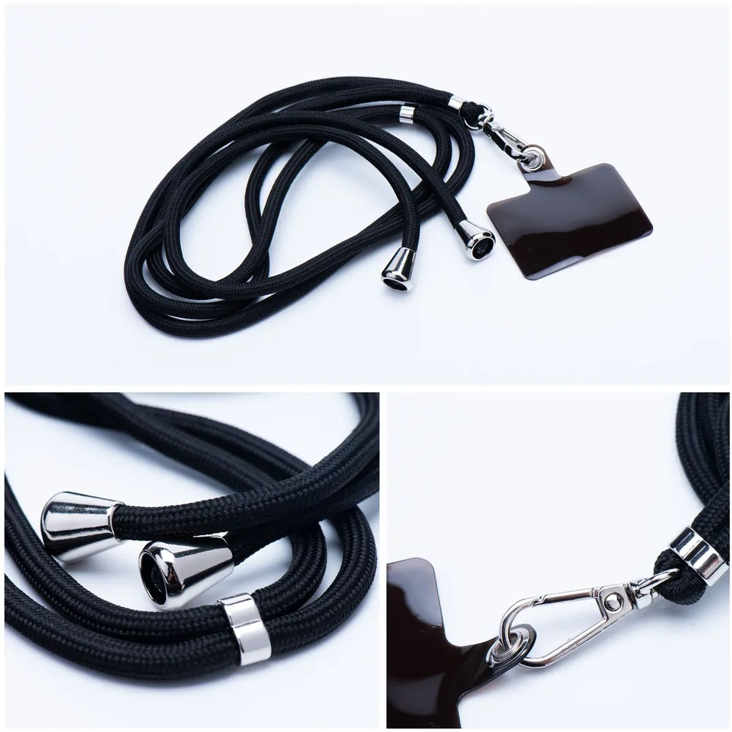 Schwarze Handyschlaufe mit schwarzem Handyhalter und silbernen Akzenten. Weißer Hintergrund.