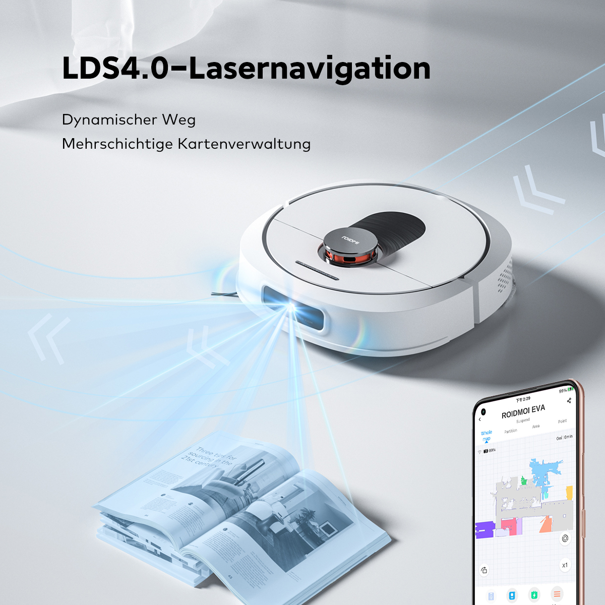 Robot sprzątający. Biało-srebrny, z telefonem pokazującym mapę sprzątanego obszaru.