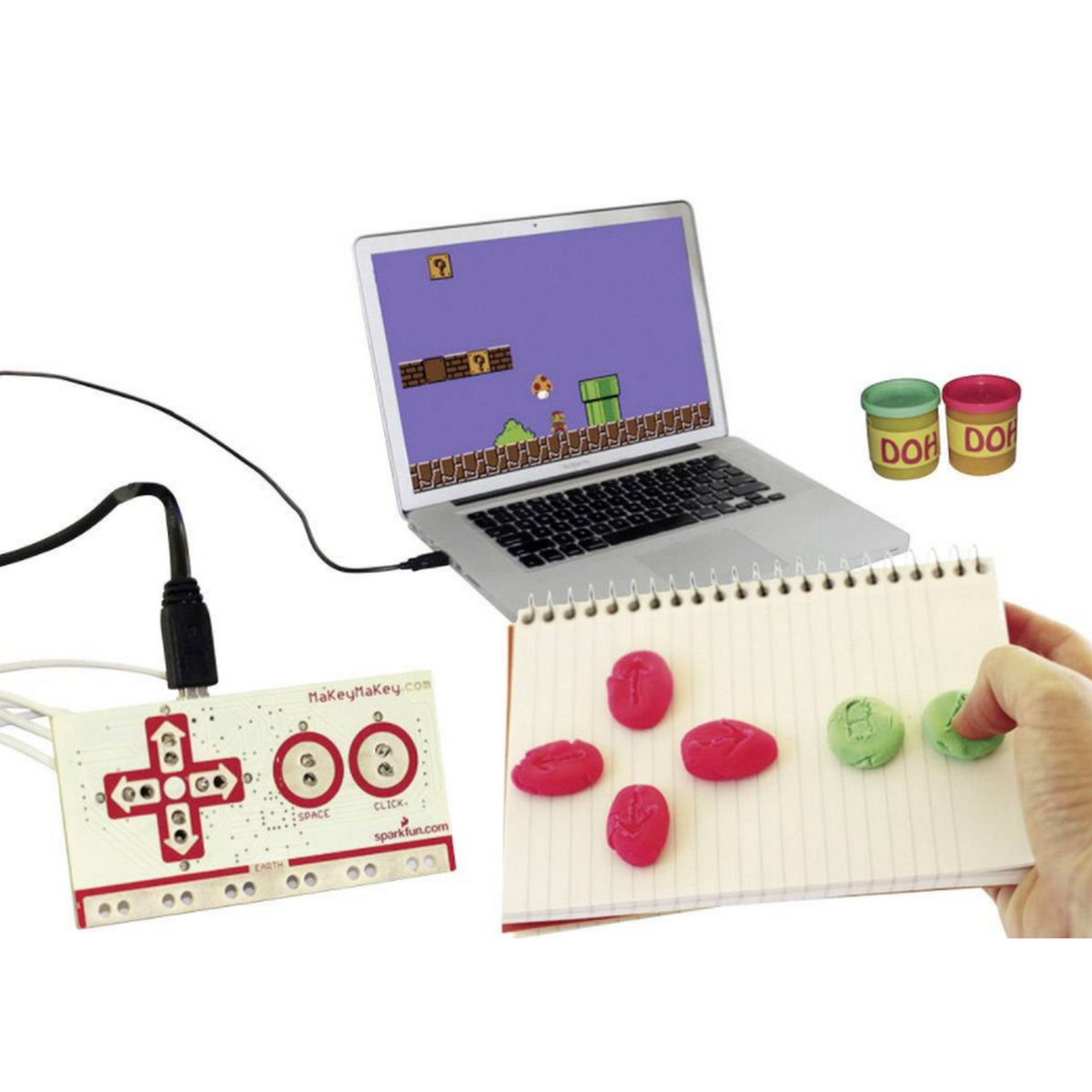 Un portátil con un videojuego en la pantalla y un controlador.
