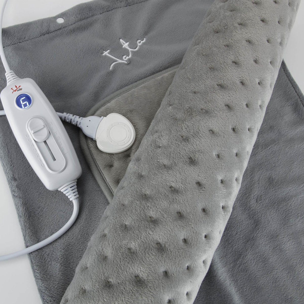 Almohadilla térmica gris con sección enrollada y control, fondo blanco.