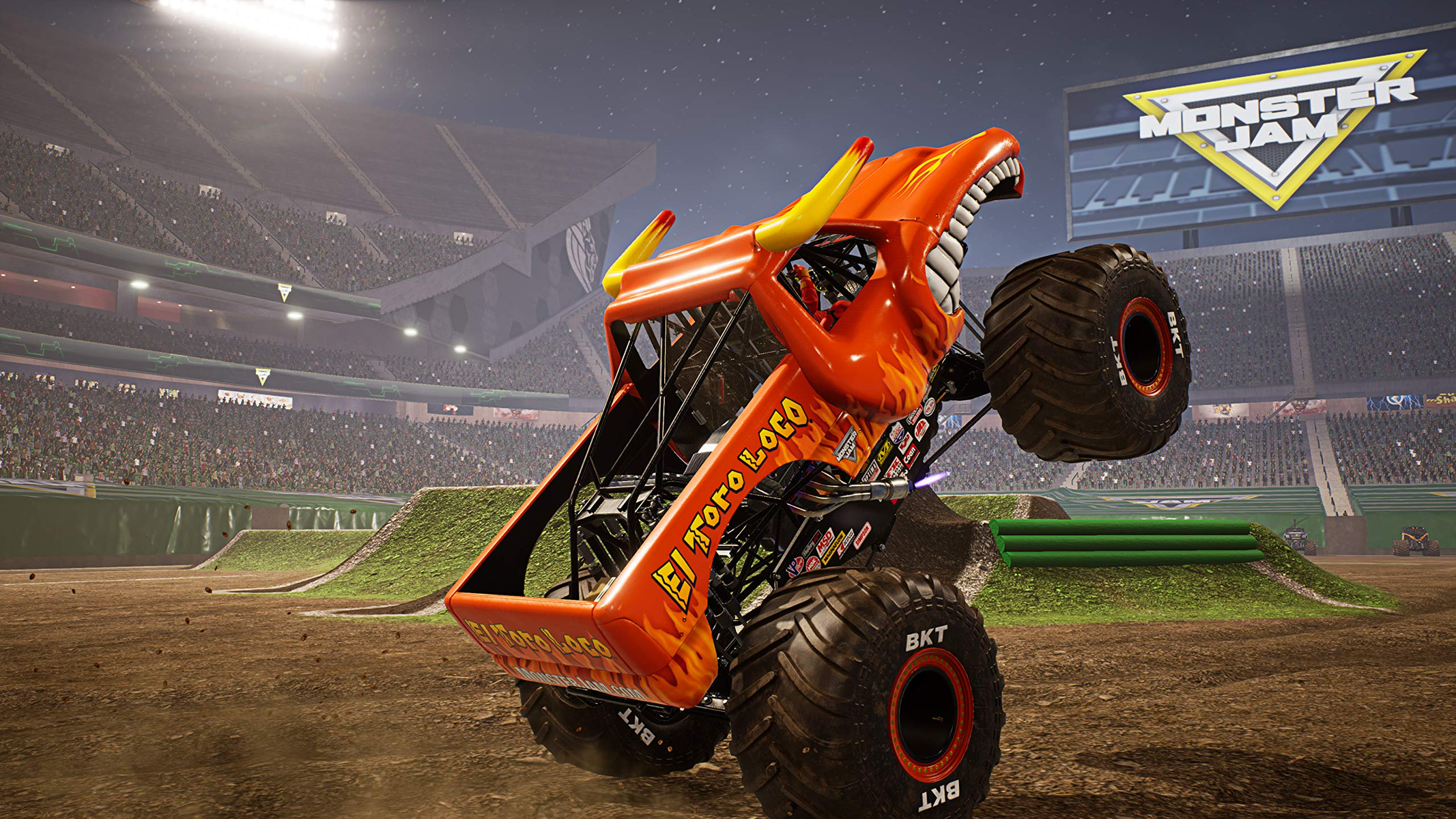 Monster truck in uno stadio, a mezz'aria. 'El Toro Loco' sul lato, fiamme arancioni e rosse.