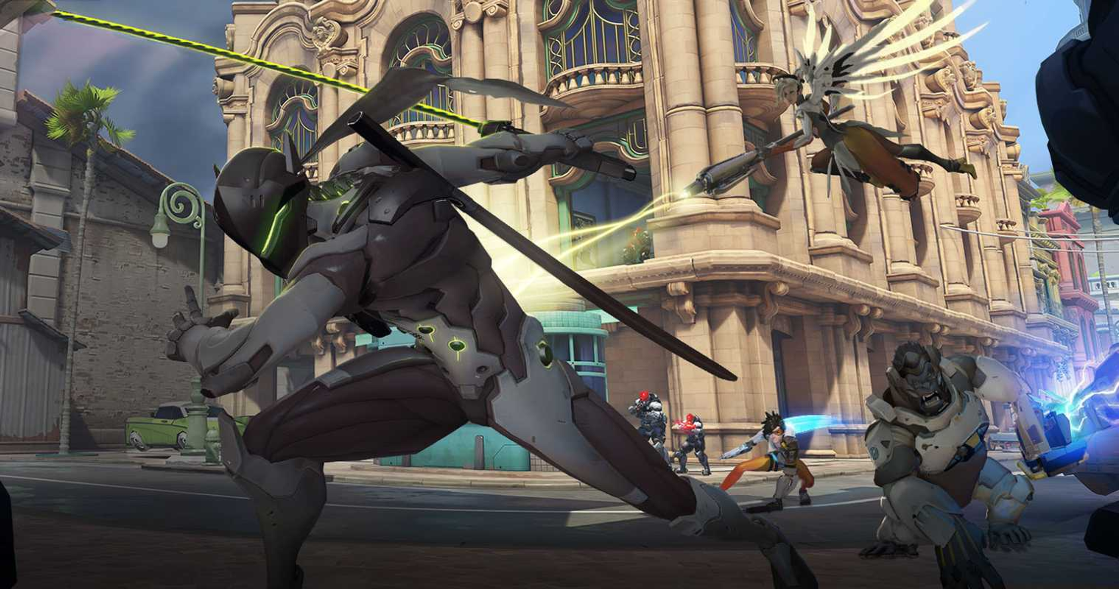 Scena z gry Overwatch. Genji walczy z Mercy. Inne postacie są w tle, w miejskim otoczeniu.