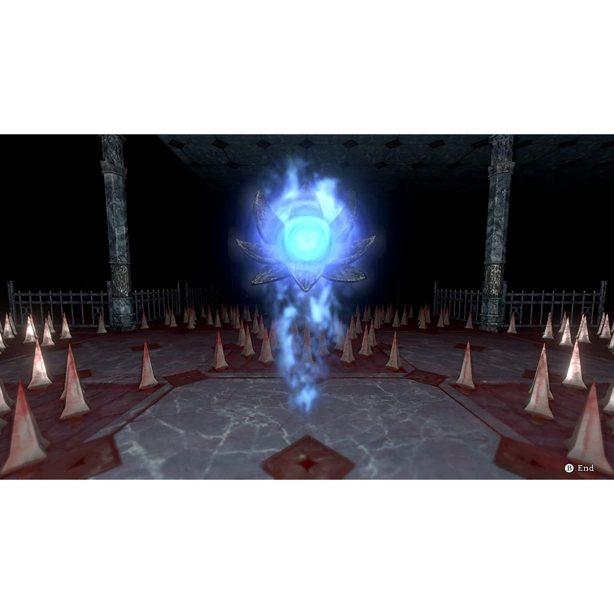 Niebieska świecąca kula w kształcie kwiatu, otoczona kolcami w ciemnym pomieszczeniu.