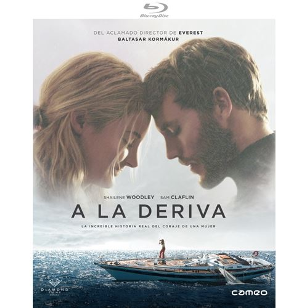 Portada de DVD de 'A la deriva'. Muestra a dos personas y un barco en el mar. Fondo azul.