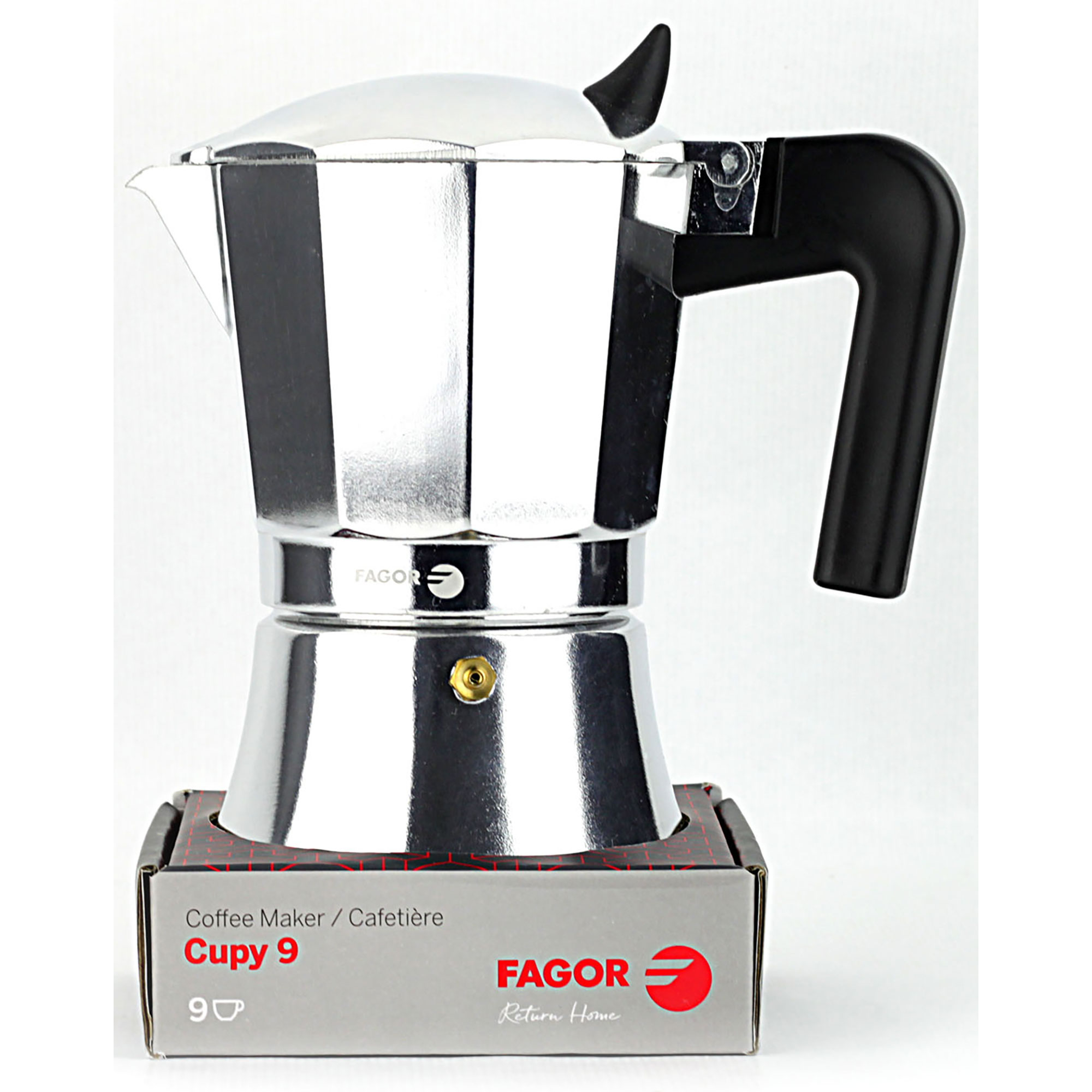 Cafetera plateada con asa negra, sobre una caja. La marca es FAGOR.