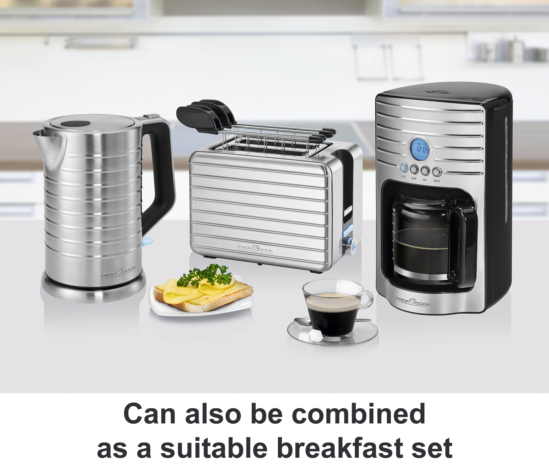 Czajnik, toster, ekspres do kawy ze stali nierdzewnej i produkty śniadaniowe.