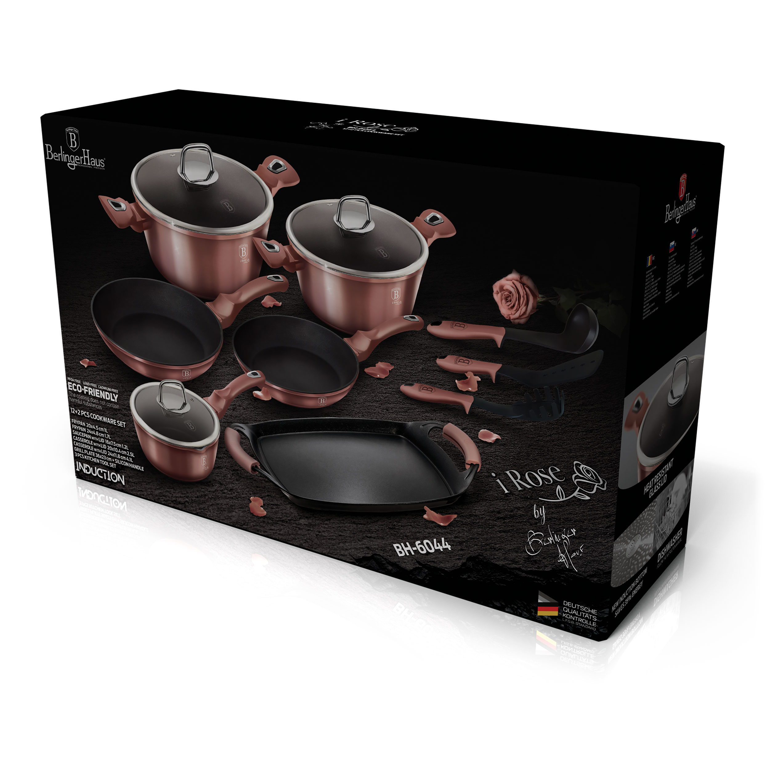 Juego de utensilios de cocina en una caja, varias sartenes y ollas.