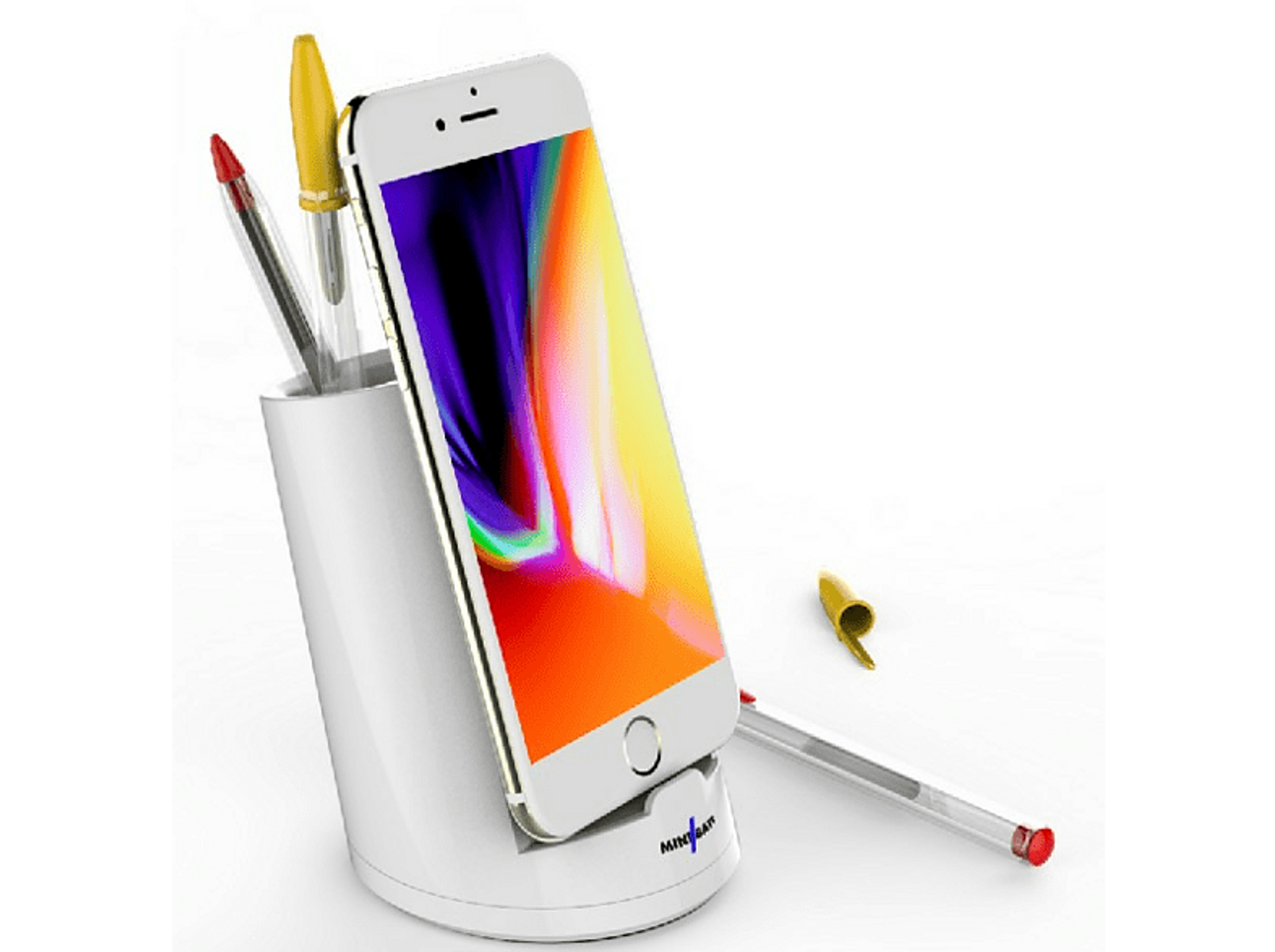 Teléfono blanco en un soporte blanco con bolígrafos. Un bolígrafo a un lado.