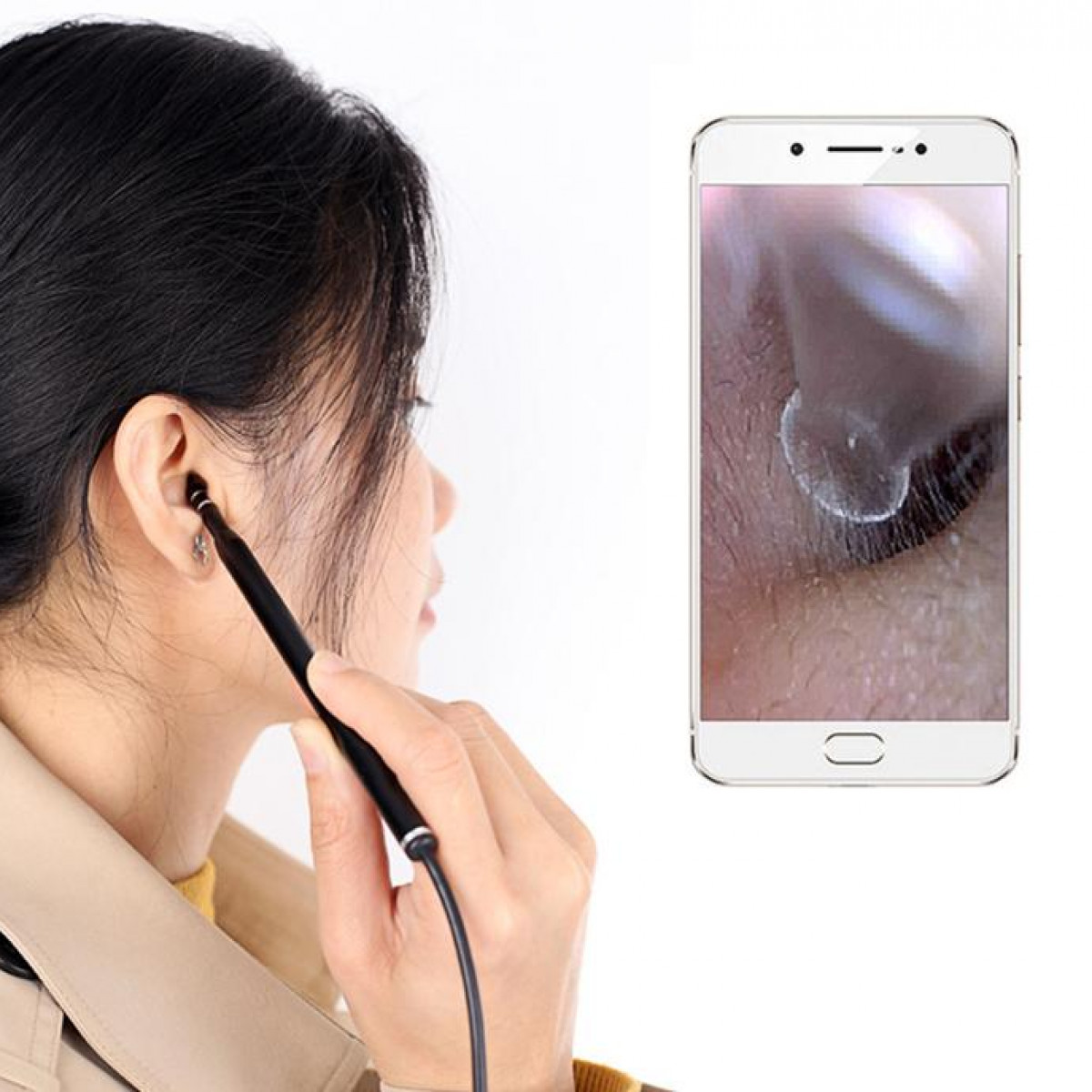 Woman using an ear camera, looking at phone screen with ear image.
